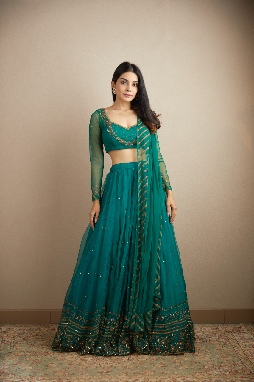 TEAL GREEN ANTIQUE SEQUENCE WORK LEHENGA SET