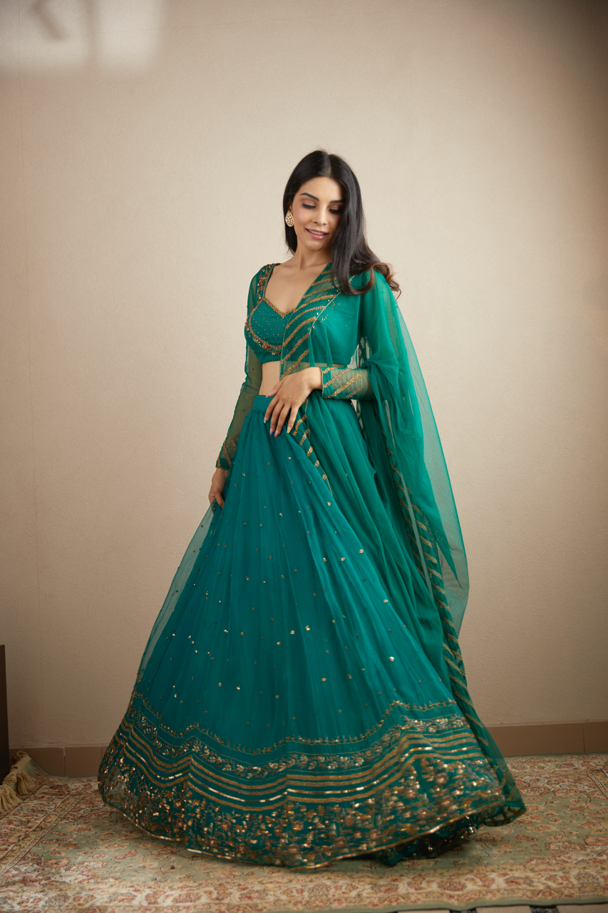 TEAL GREEN ANTIQUE SEQUENCE WORK LEHENGA SET