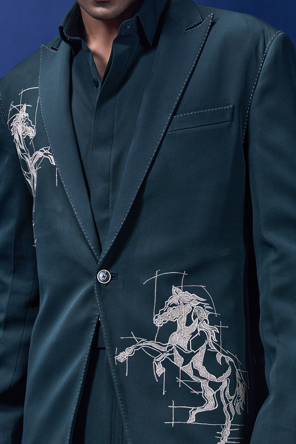 Green blazer detailing with thread work and horse embroidery