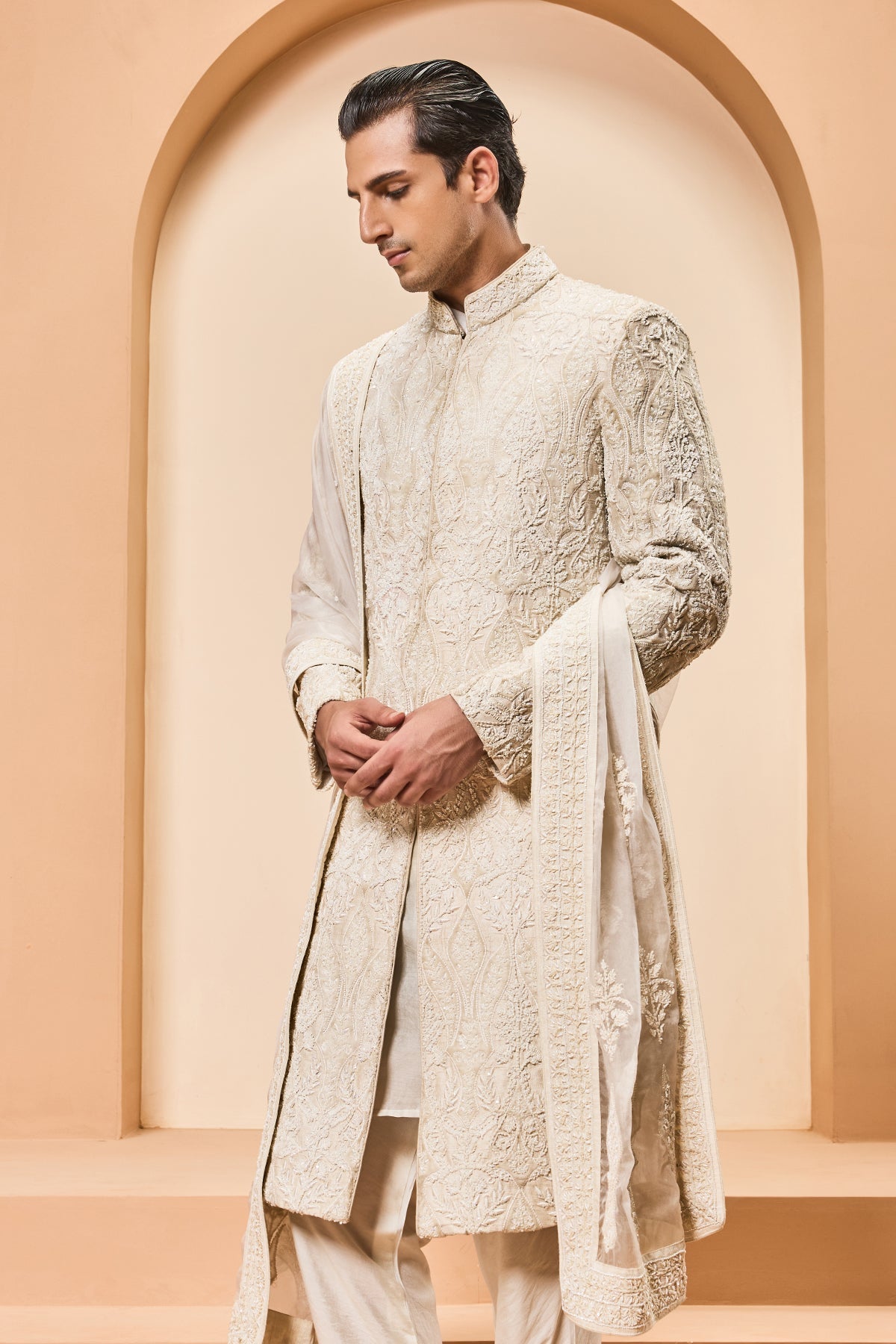 Ivory sherwani detailing with pearl sequins and aplic work