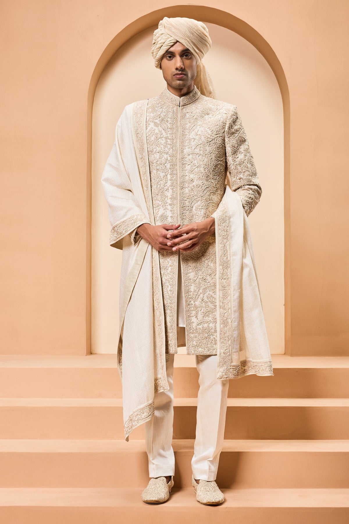 Ivory sherwani detailing with gold zari pearl sequins and spring work