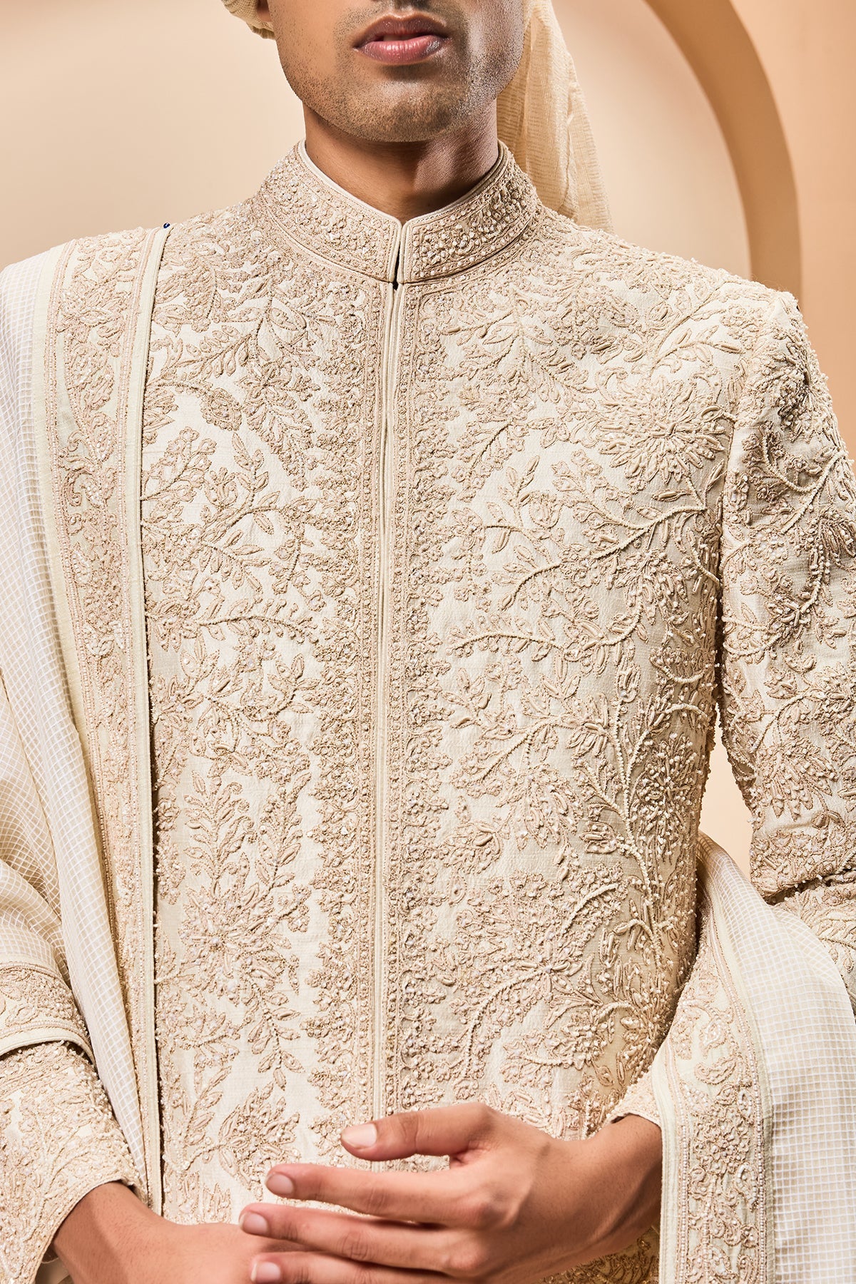 Ivory sherwani detailing with gold zari pearl sequins and spring work