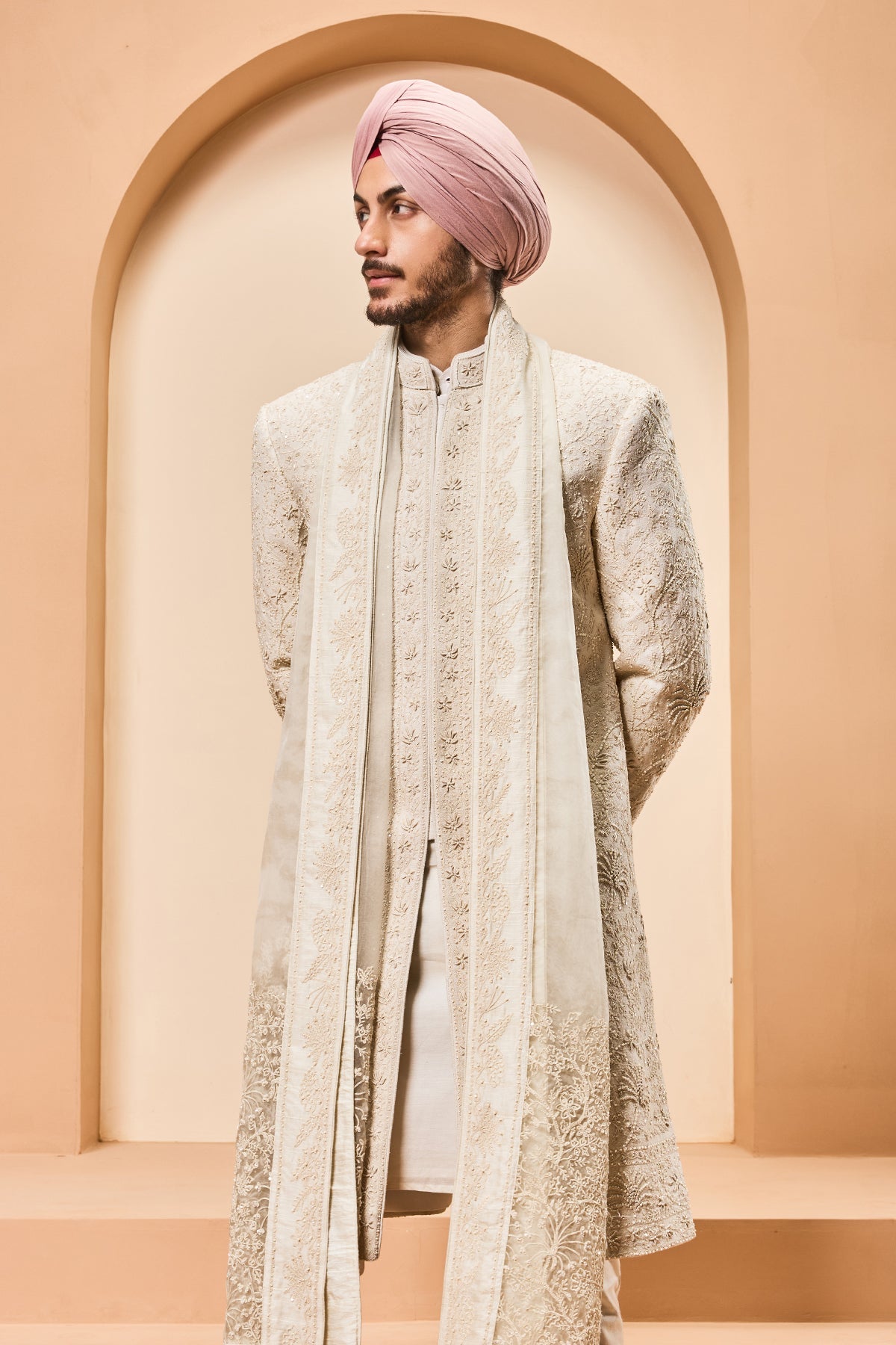 Ivory sherwani detailing with pearl sequins and thread work