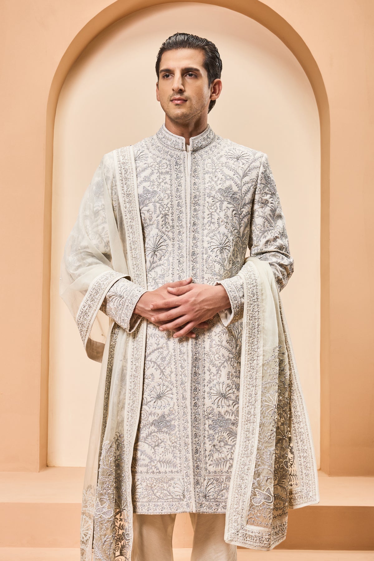 Ivory sherwani detailing with silver zari pearl sequins and thread work
