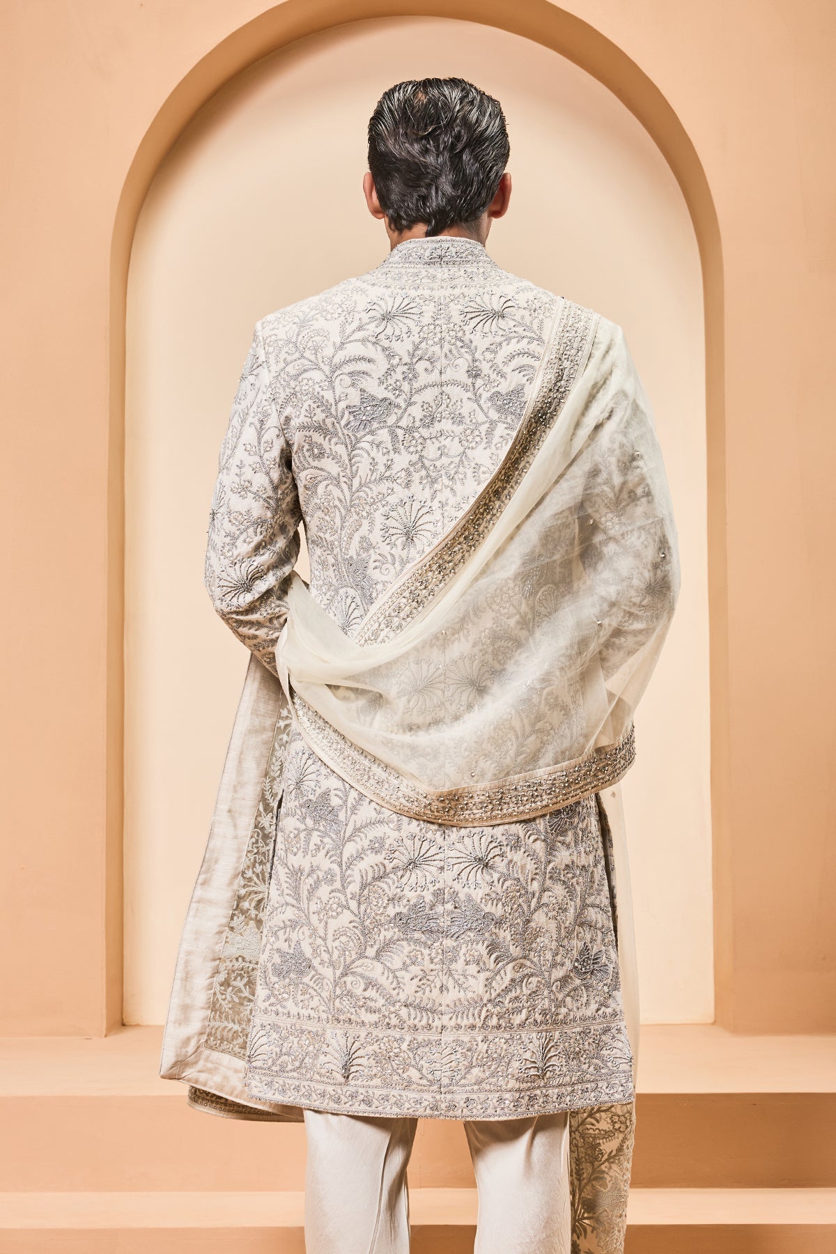 Ivory sherwani detailing with silver zari pearl sequins and thread work