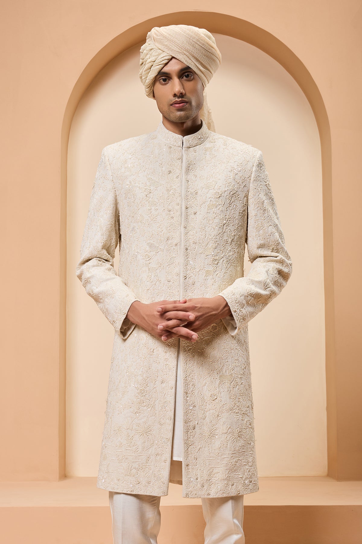 Ivory sherwani detailing with pearl sequins and thread work