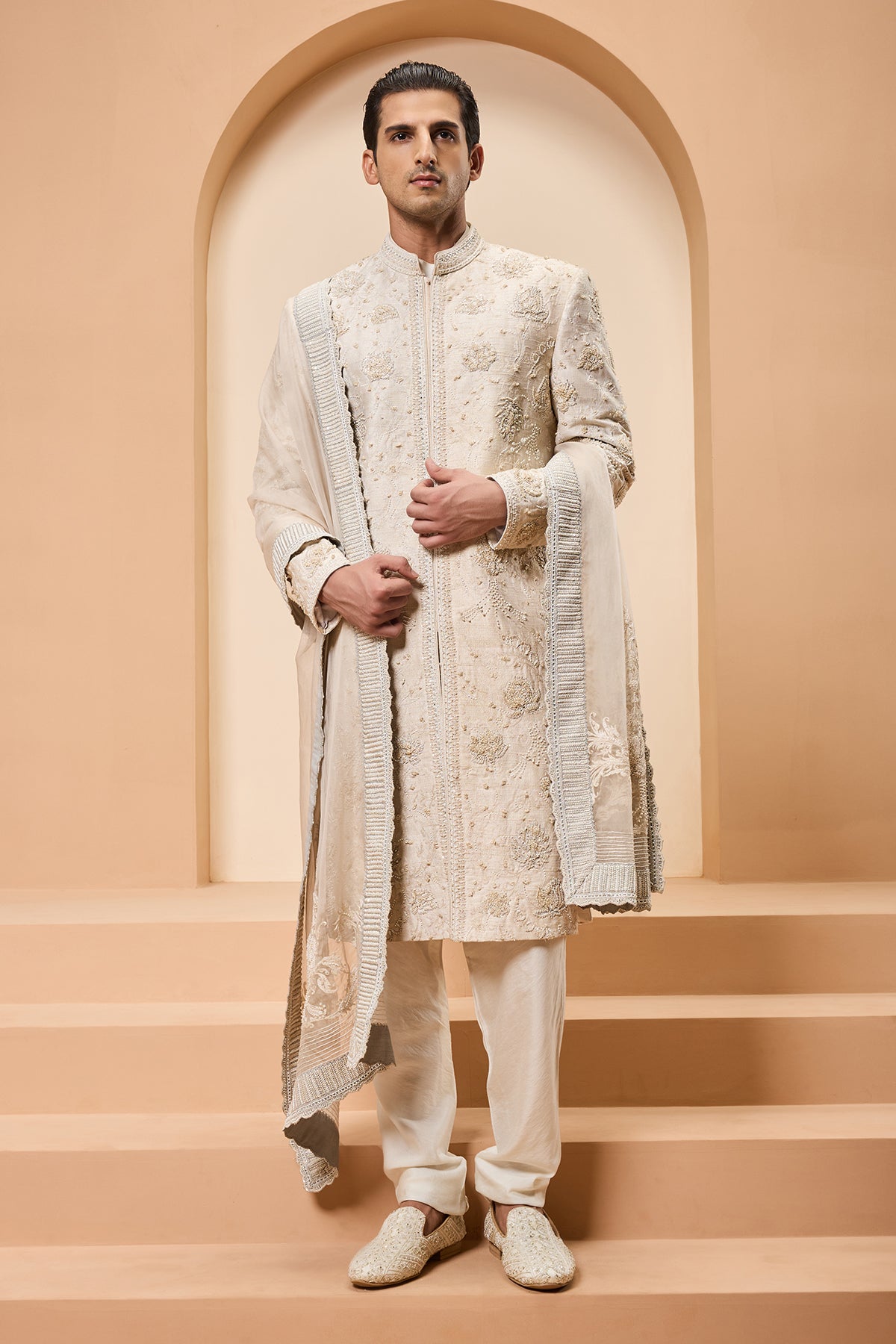 Ivory sherwani detailing with pearl sequins and thread work