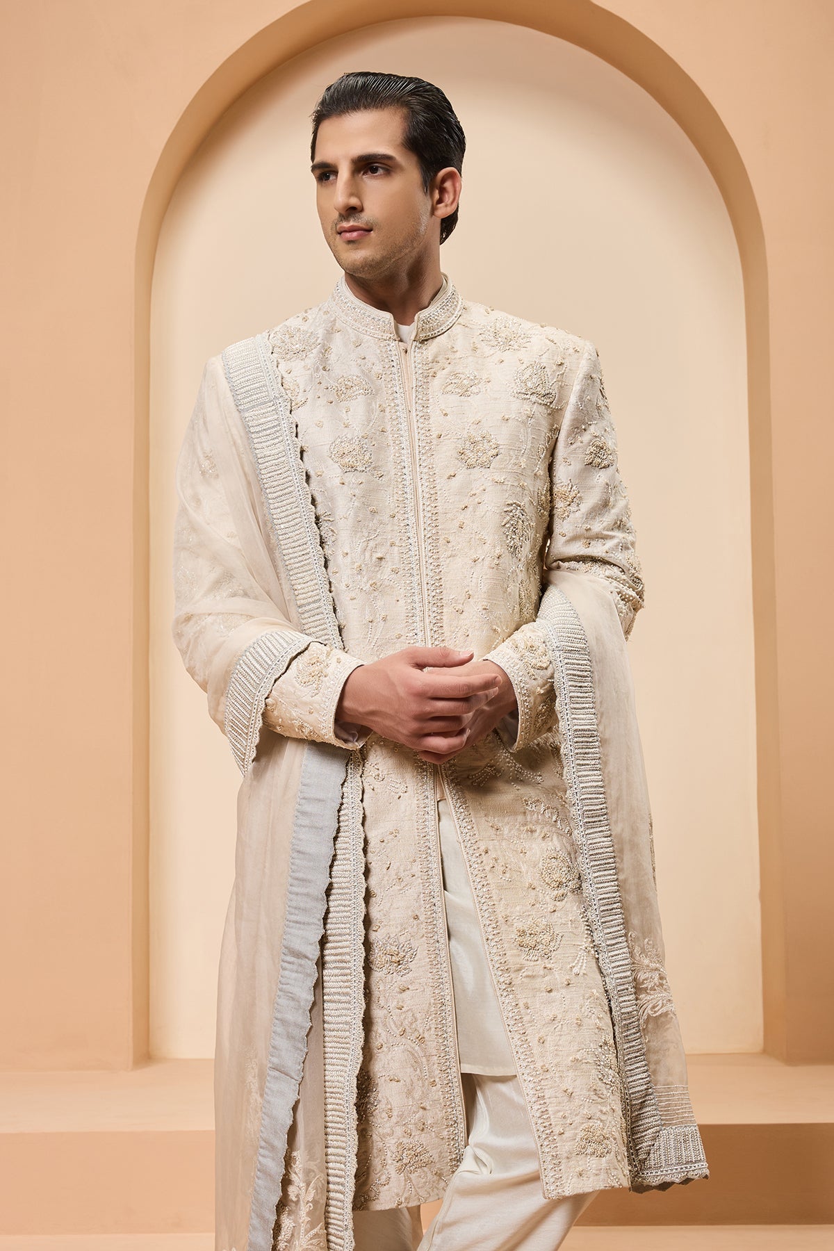 Ivory sherwani detailing with pearl sequins and thread work