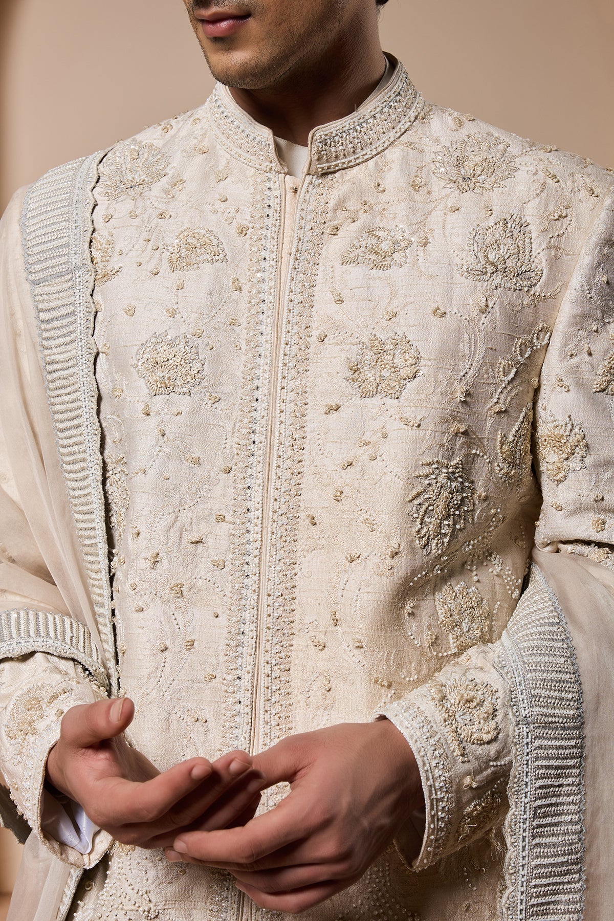 Ivory sherwani detailing with pearl sequins and thread work