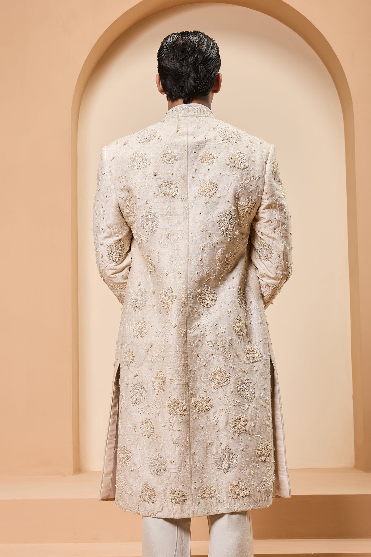 Ivory sherwani detailing with pearl sequins and thread work