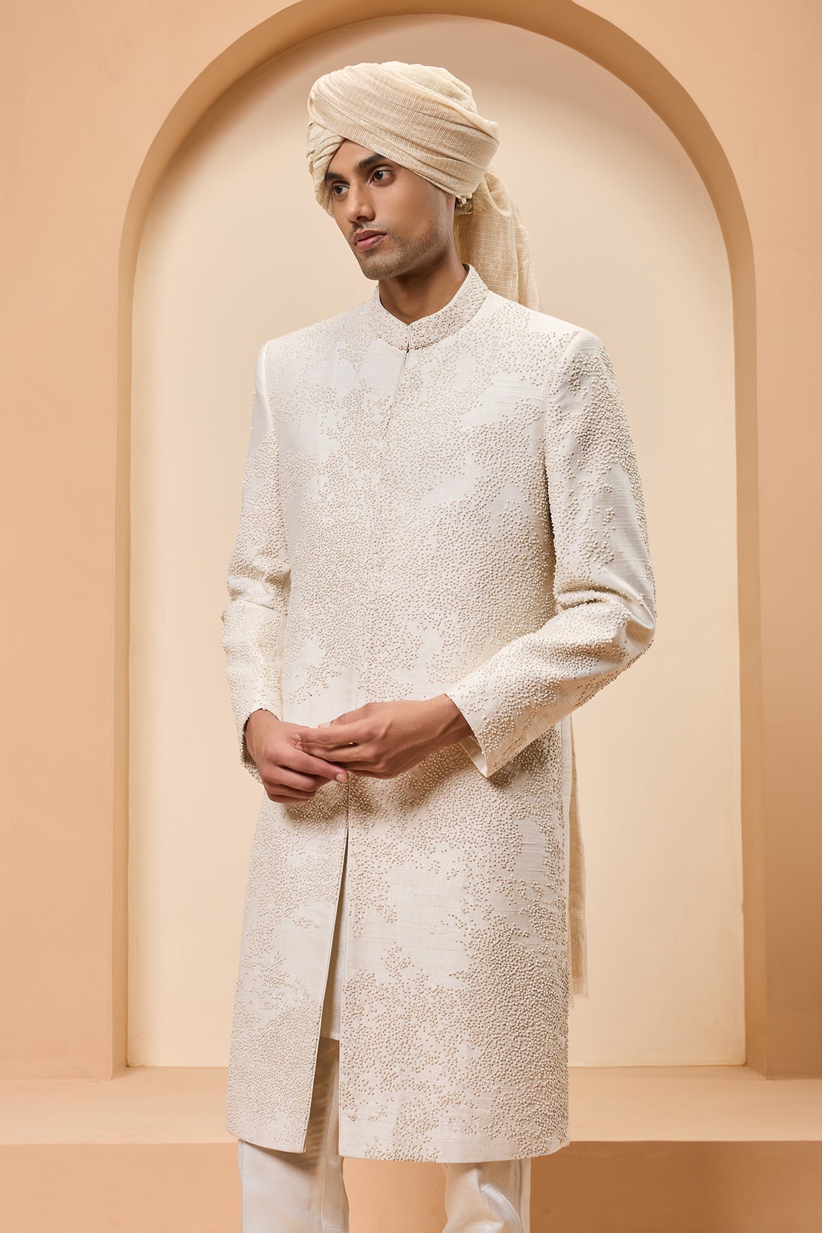 Ivory sherwani detailing with pearl sequins and thread work