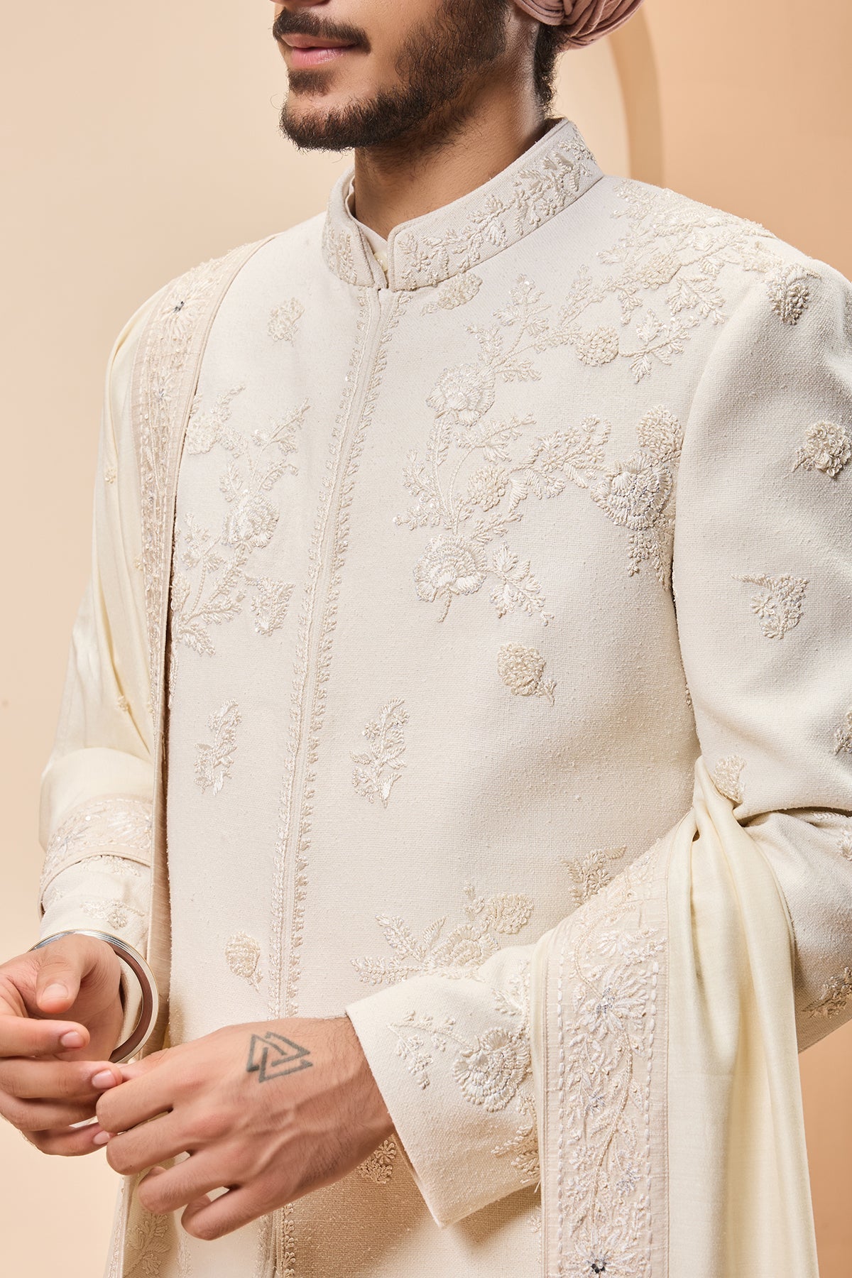 Ivory sherwani detailing with sequins and with thread work