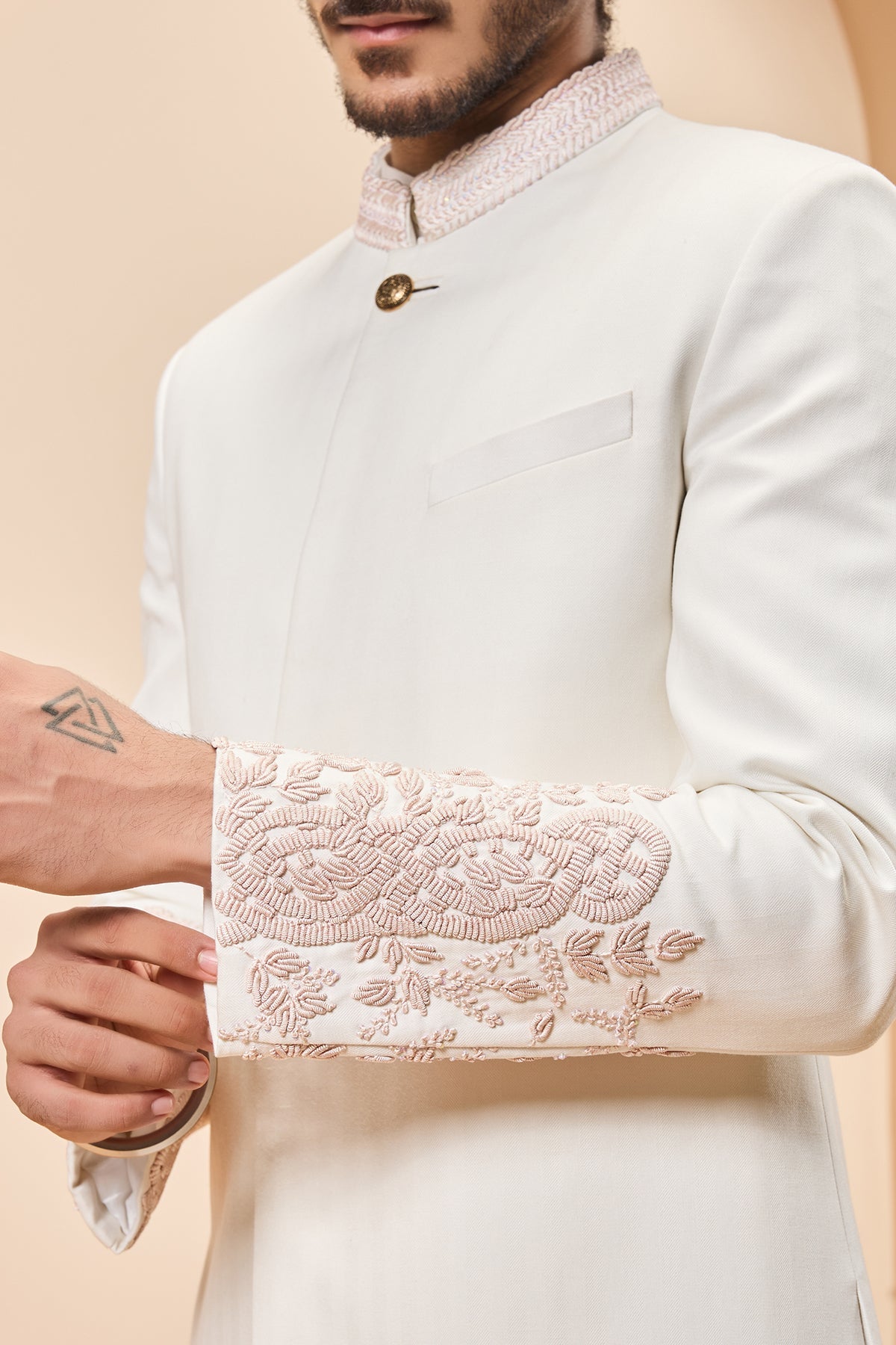 Ivory sherwani detailing with sequins and with thread work