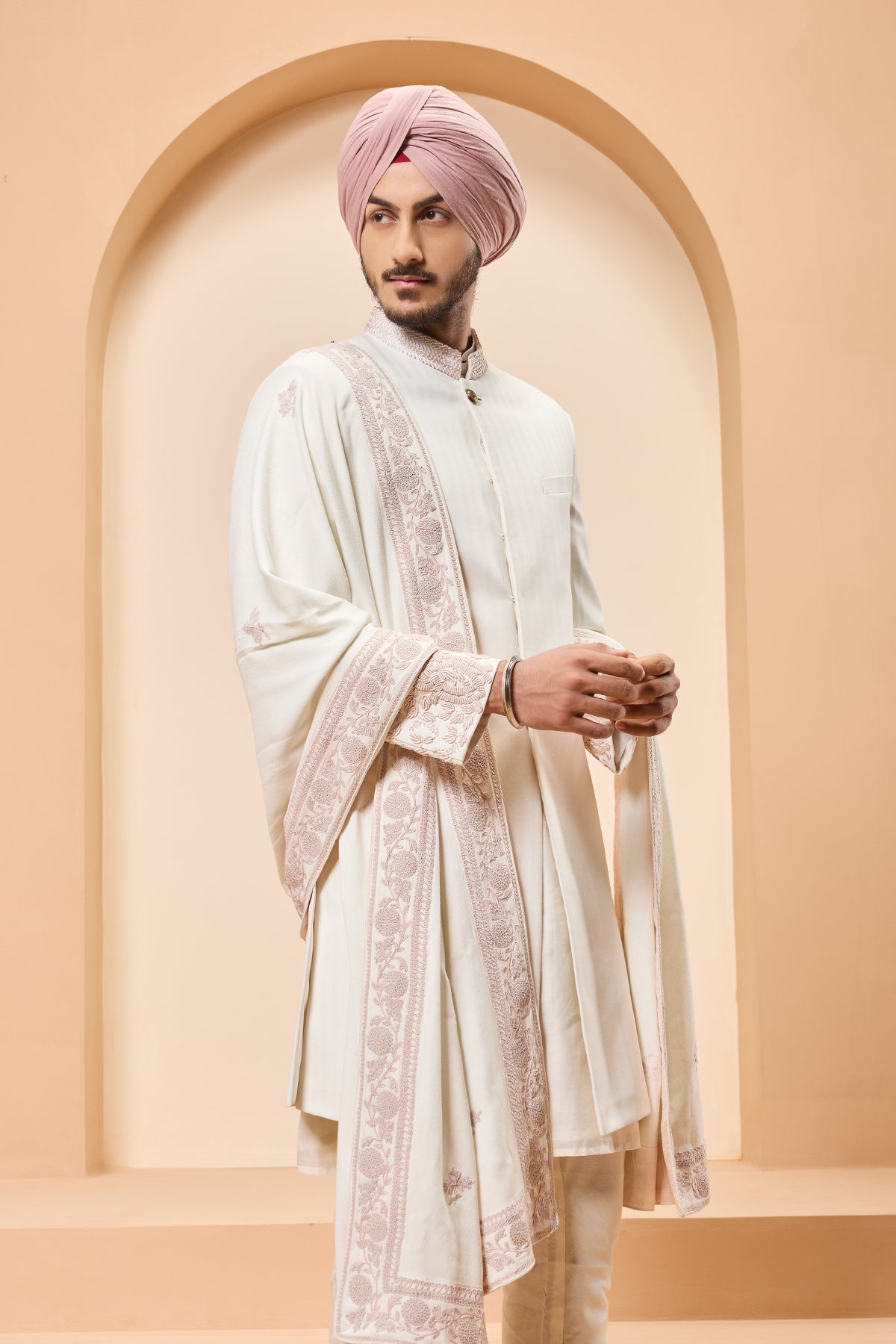 Ivory sherwani detailing with sequins and with thread work
