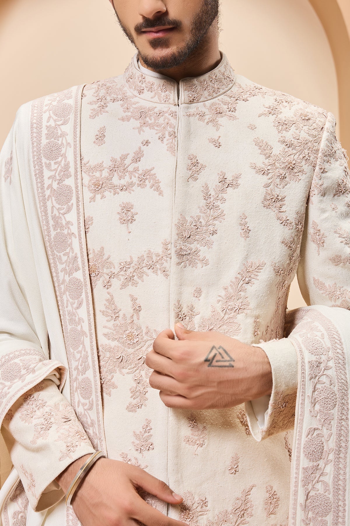 Ivory sherwani detailing with pearl sequins and thread work