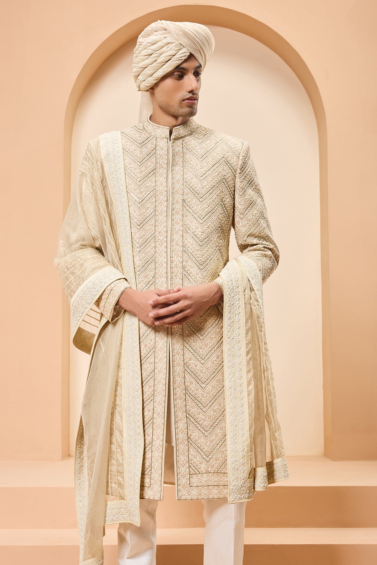 Ivory gold sherwani detailing with zardozi pearl sequins and thread work