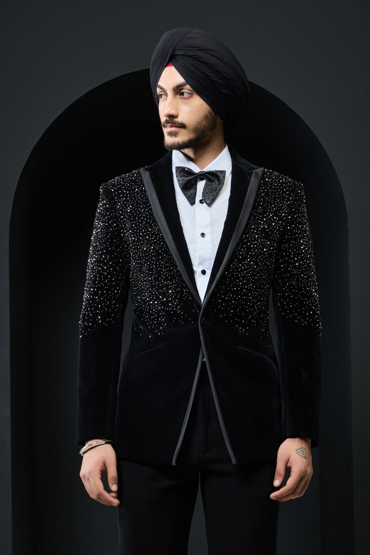 Black tuxedo highlighted with pearls and crystal