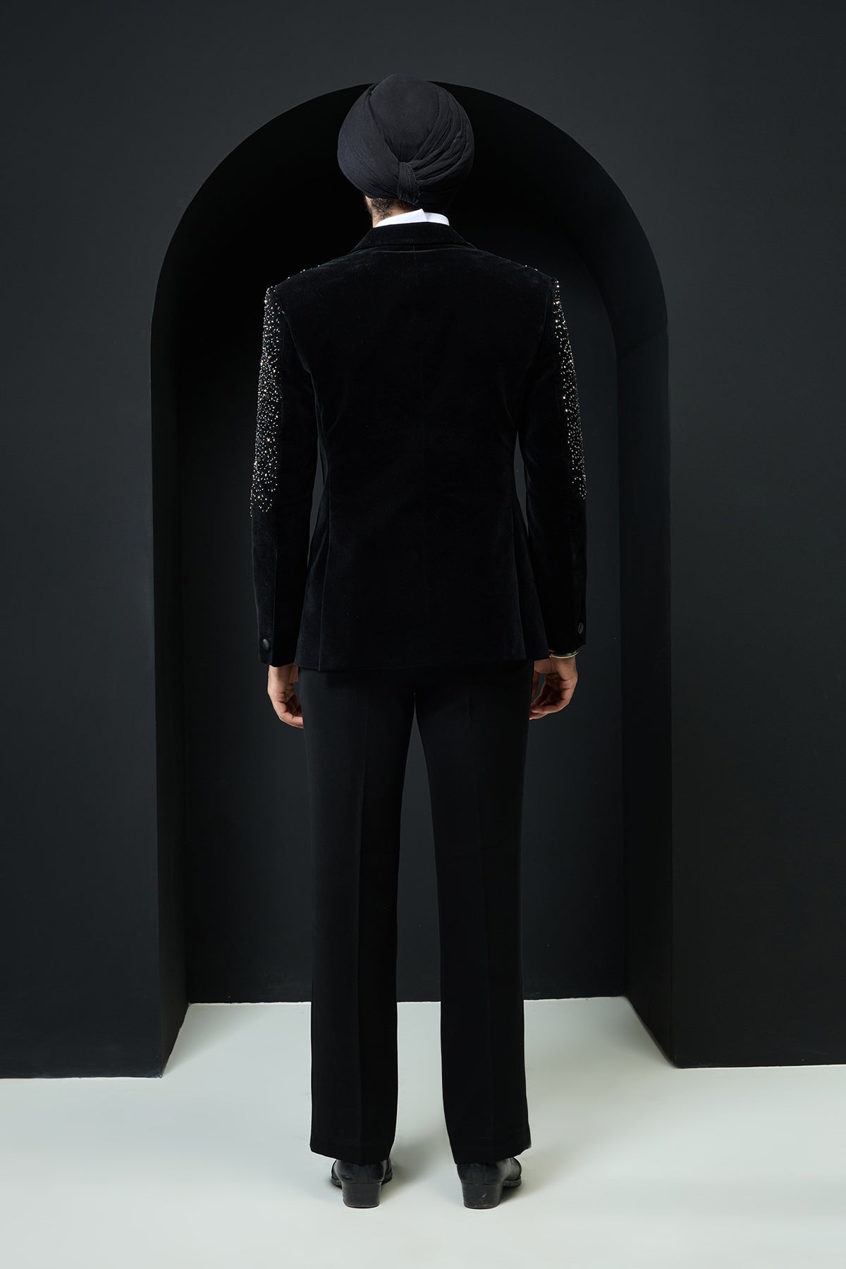 Black tuxedo highlighted with pearls and crystal