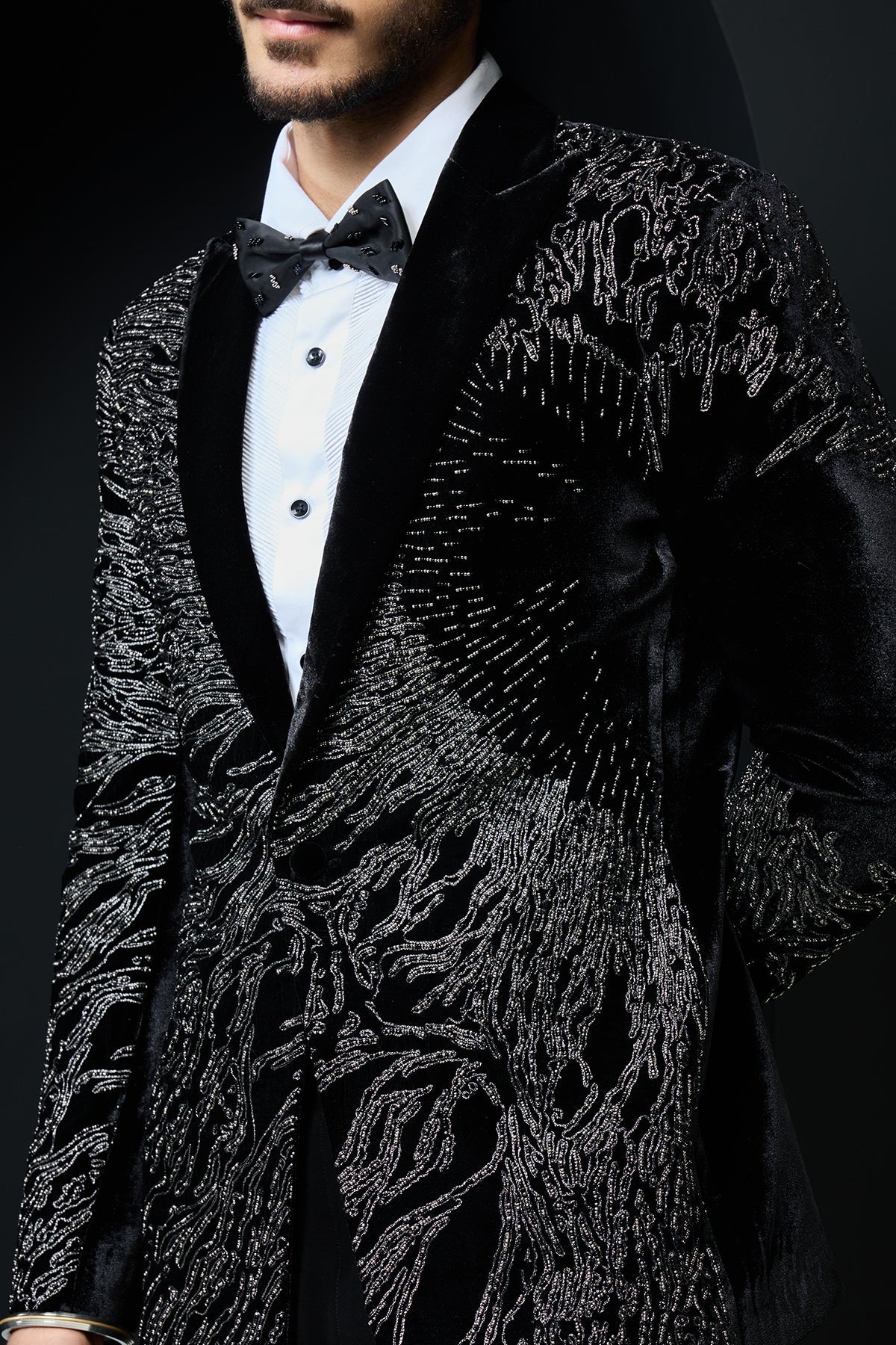 Black tuxedo highlighted with silver zari and peals