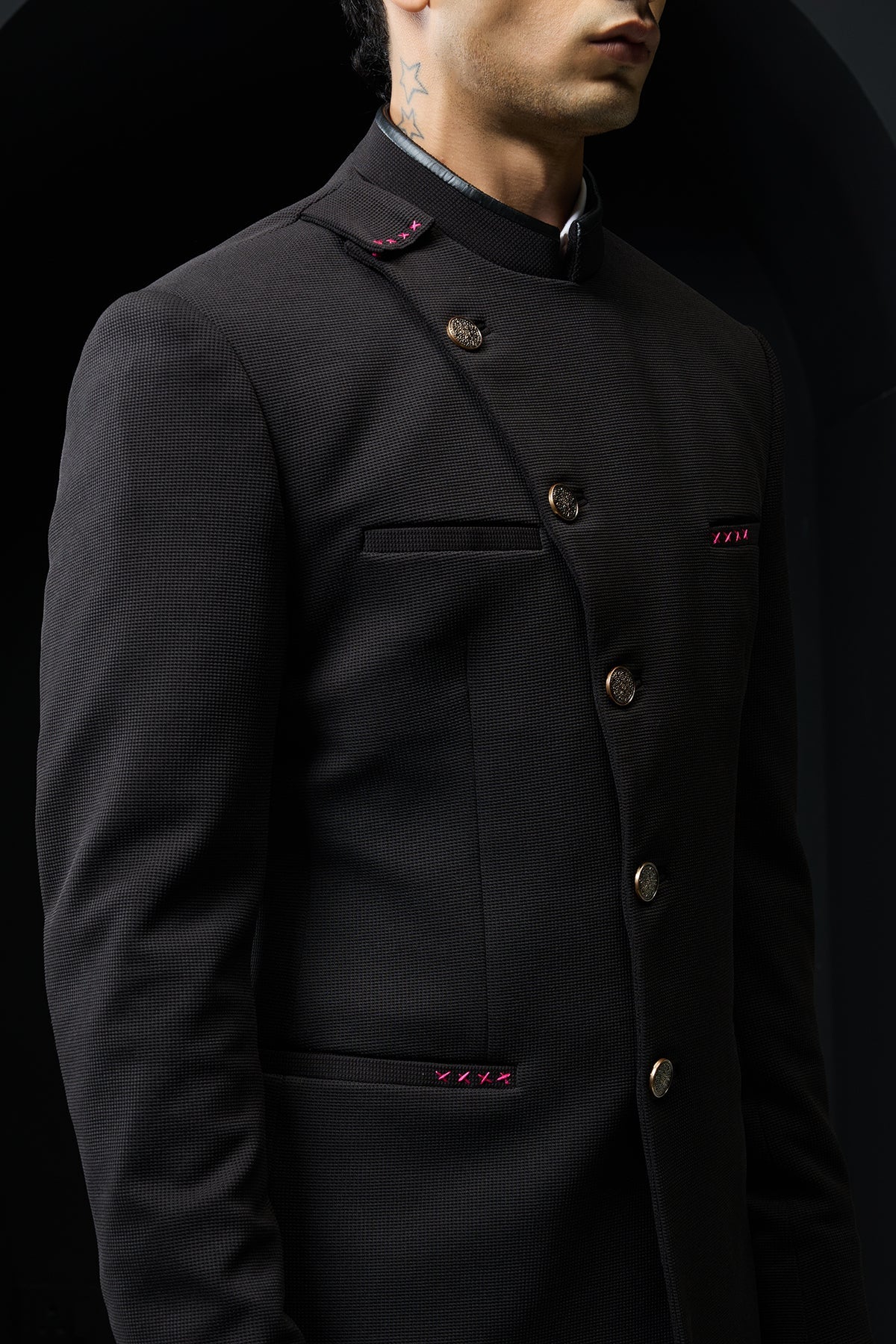 Black bandhgala with slant cut detailing with golden button and with satin taping