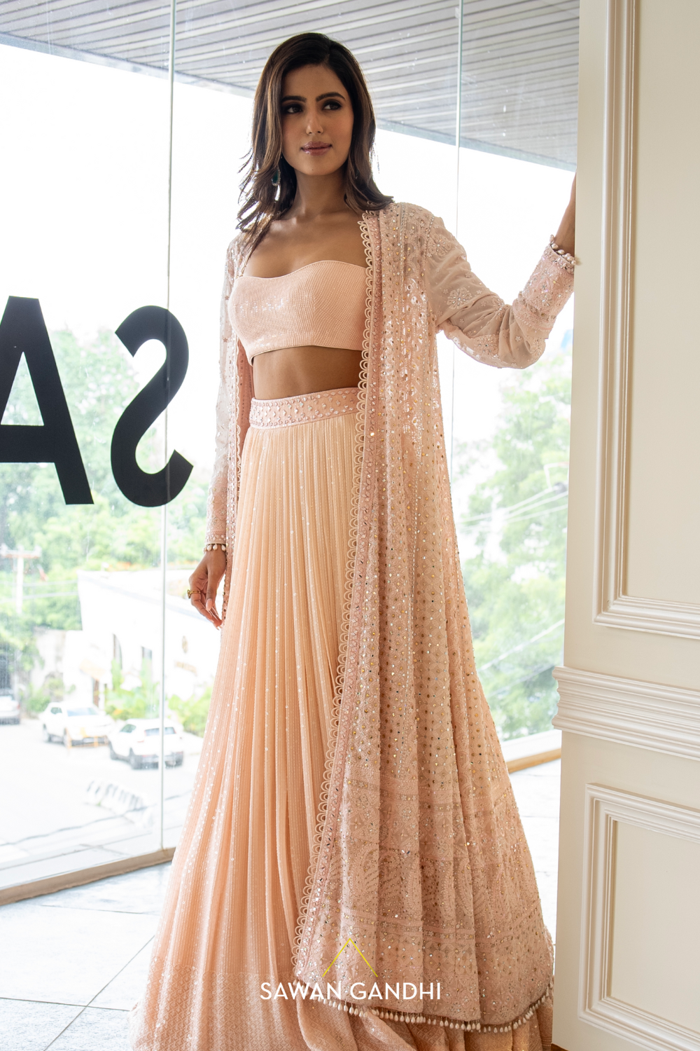 Peach sequins lehenga with Chikankari cape