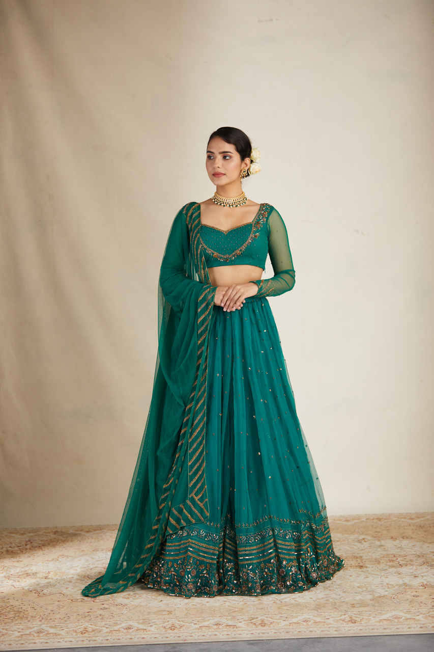 TEAL GREEN ANTIQUE SEQUENCE WORK LEHENGA SET