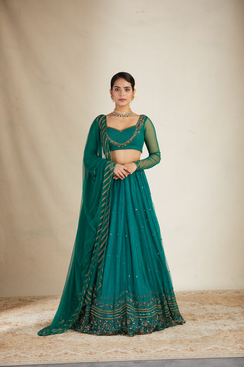 TEAL GREEN ANTIQUE SEQUENCE WORK LEHENGA SET