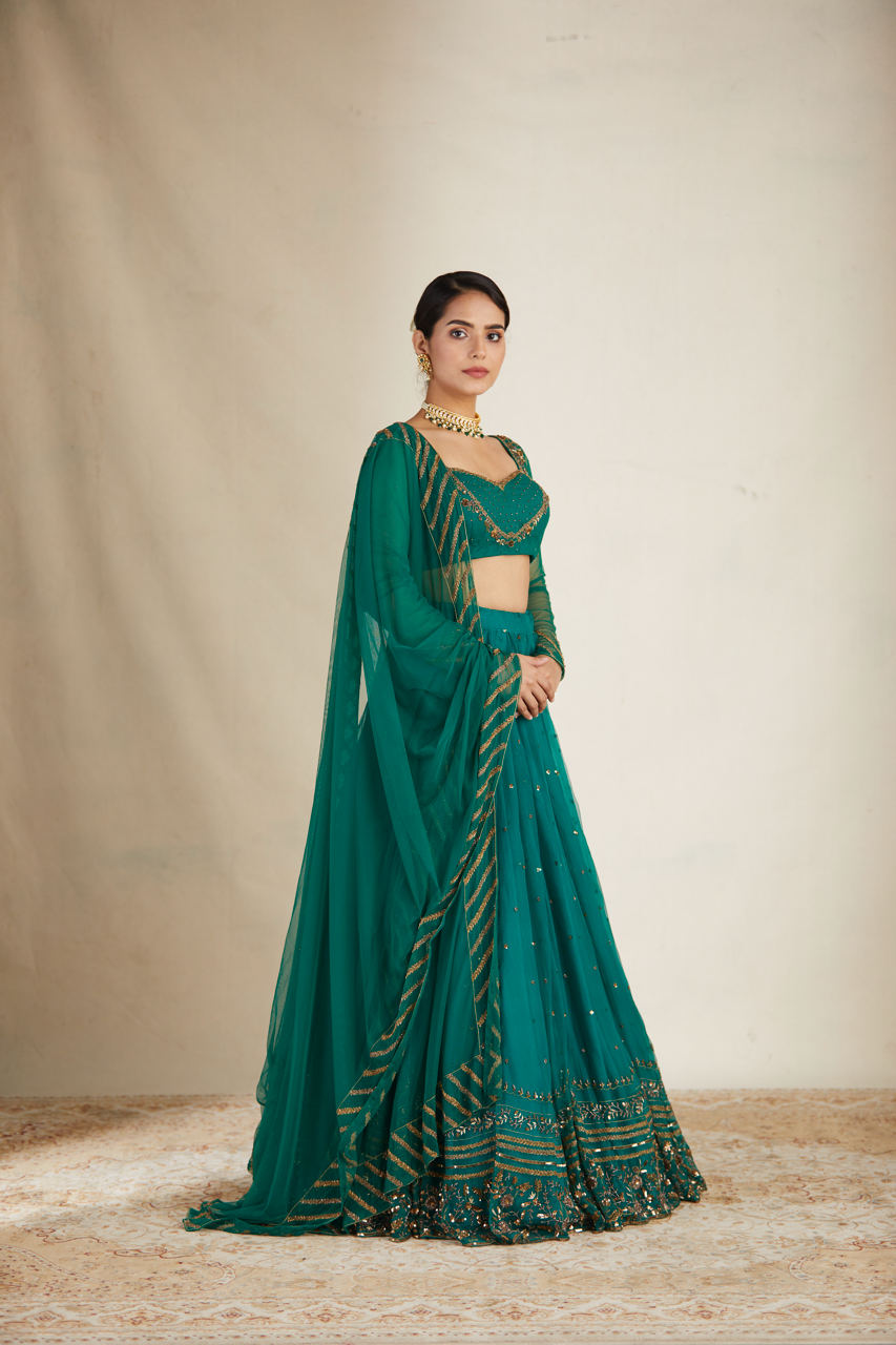 TEAL GREEN ANTIQUE SEQUENCE WORK LEHENGA SET