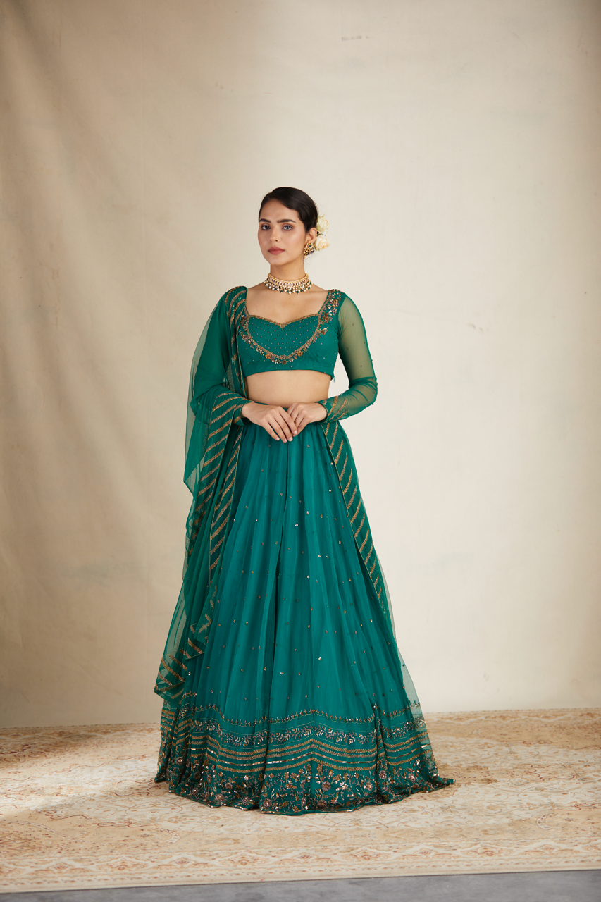 TEAL GREEN ANTIQUE SEQUENCE WORK LEHENGA SET