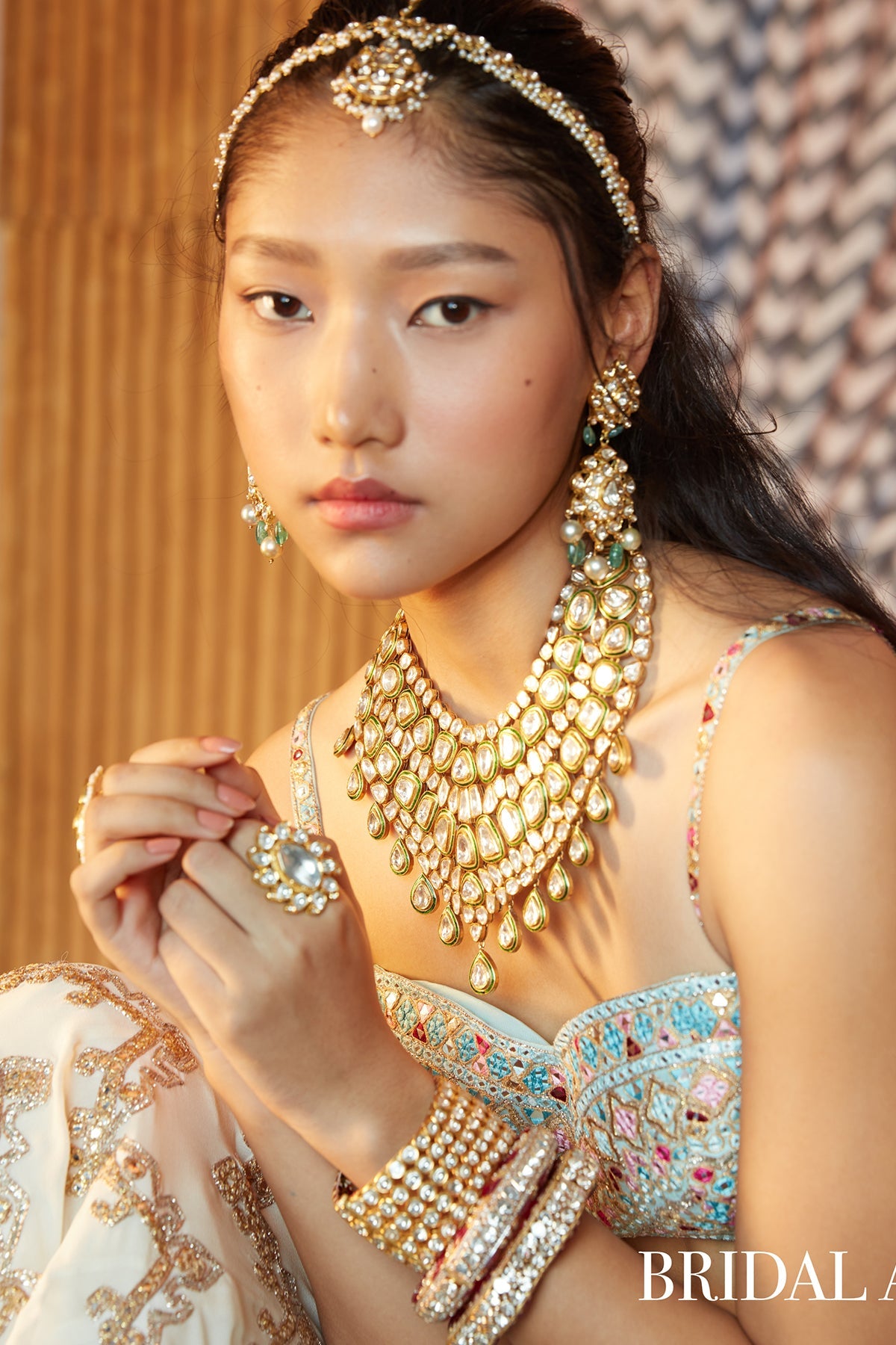 Ivory Georgette Chevron Embroidered Lehenga Paired With A Blue Blouse And Organza Dupatta