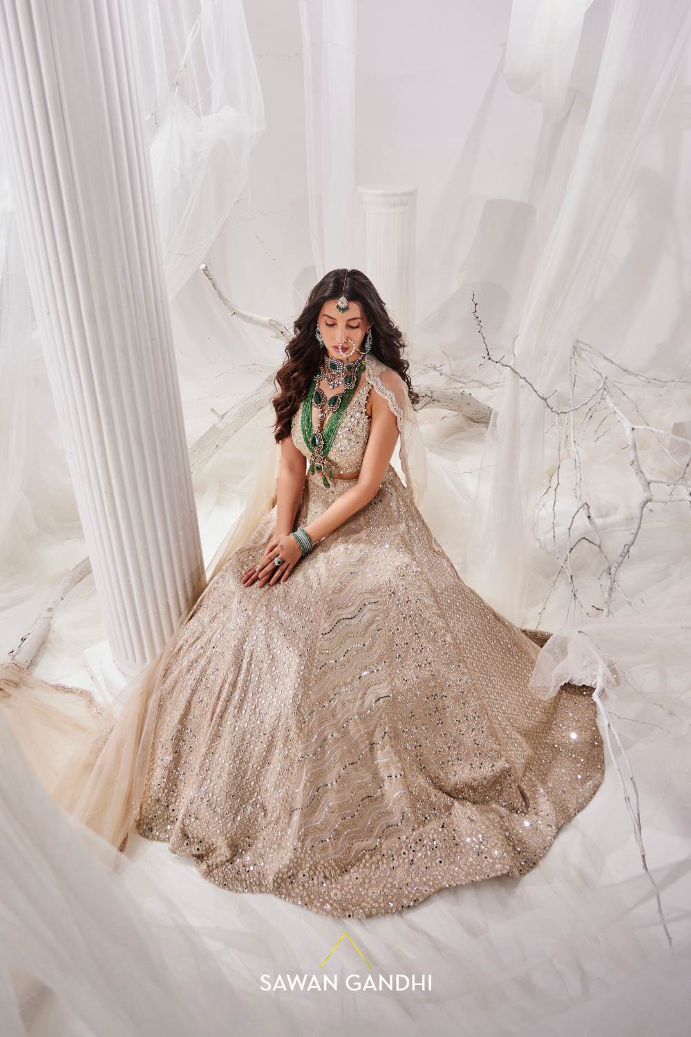 Nora Fatehi in Gold beige beadwork lehenga