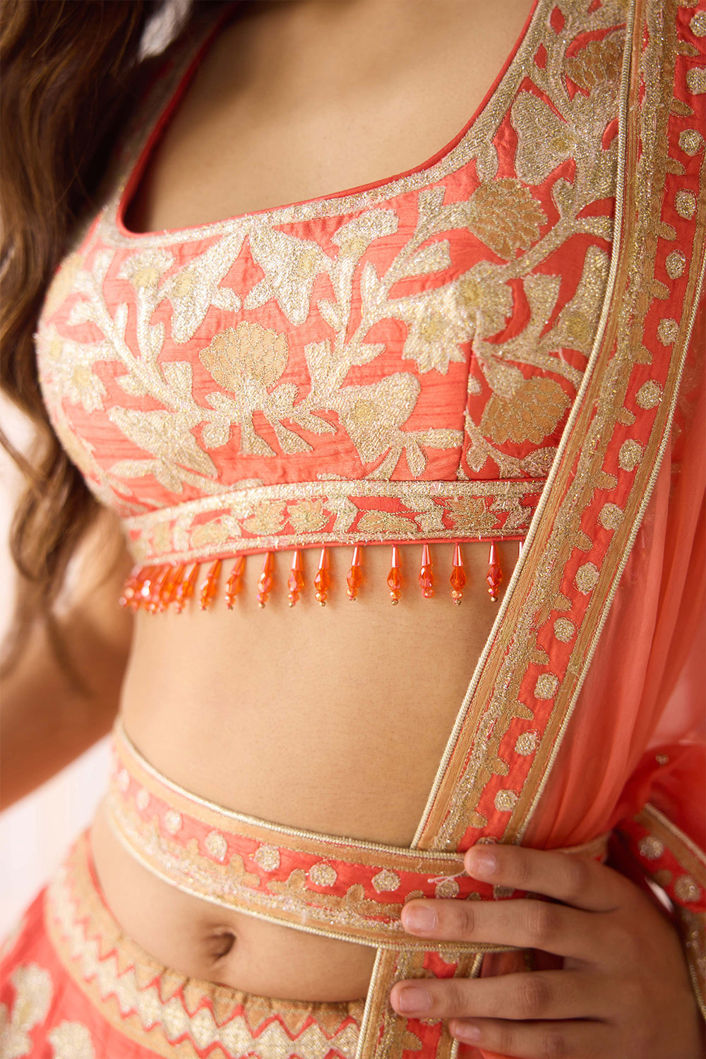 Coral Orange Lehenga Set.