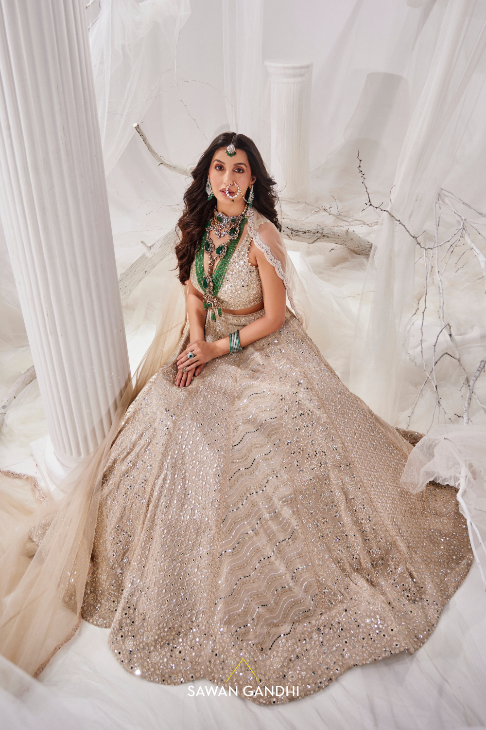 Nora Fatehi in Gold beige beadwork lehenga