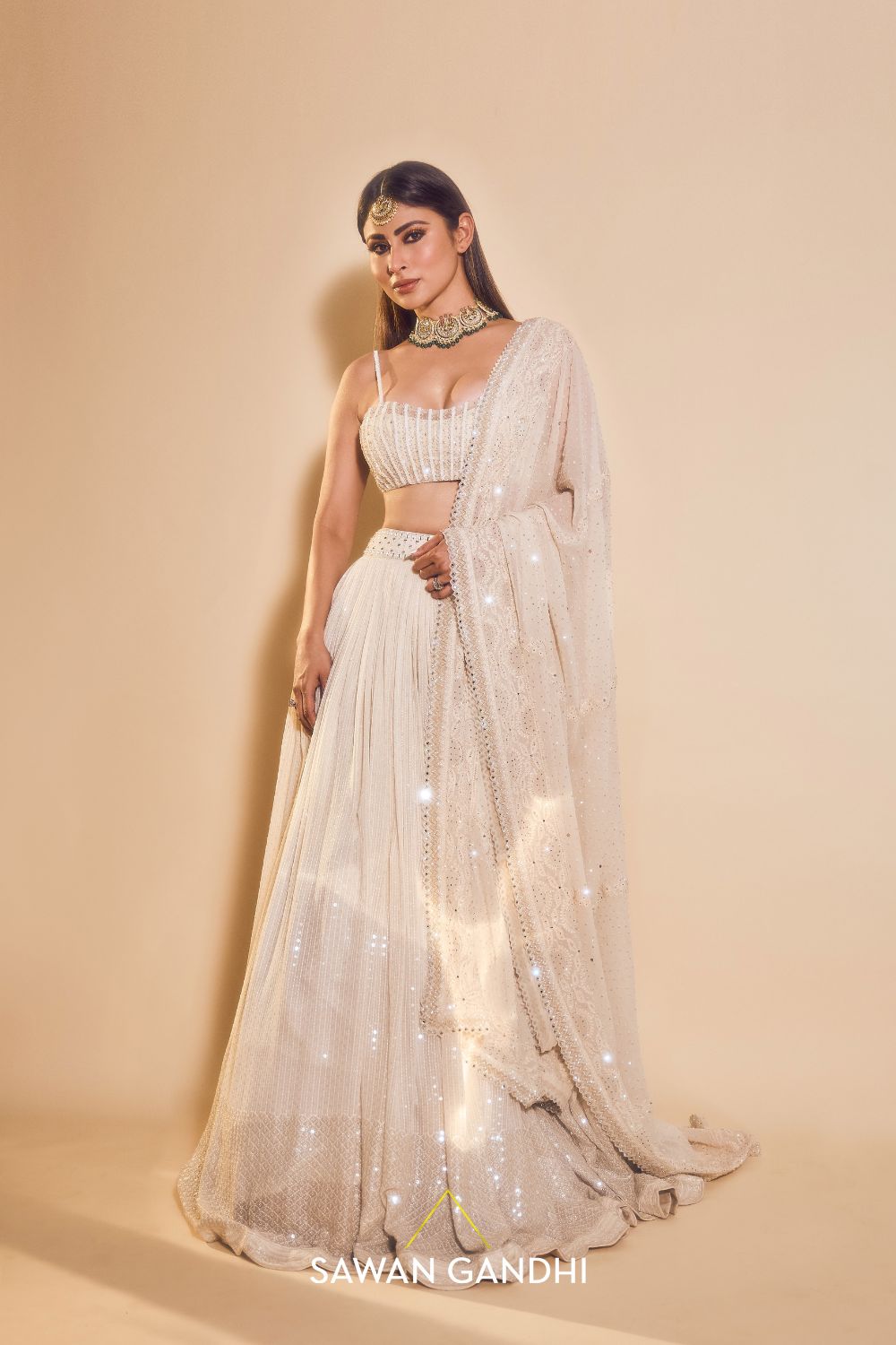Mouni Roy in Ivory sequins lehnga set