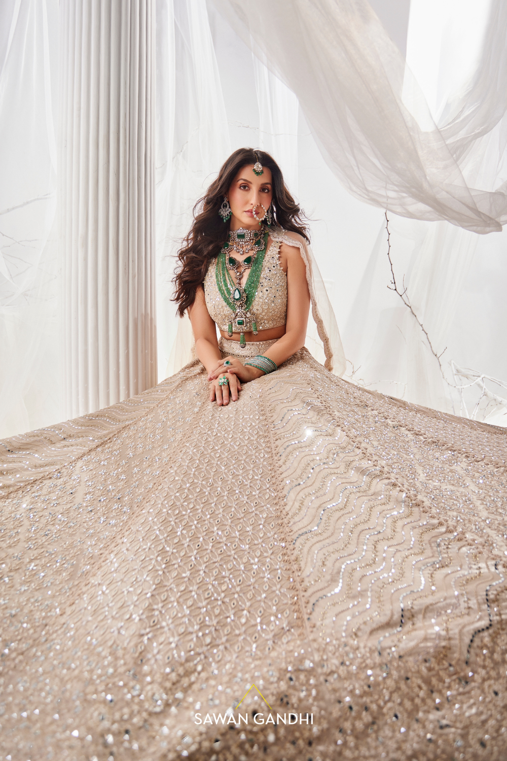 Nora Fatehi in Gold beige beadwork lehenga