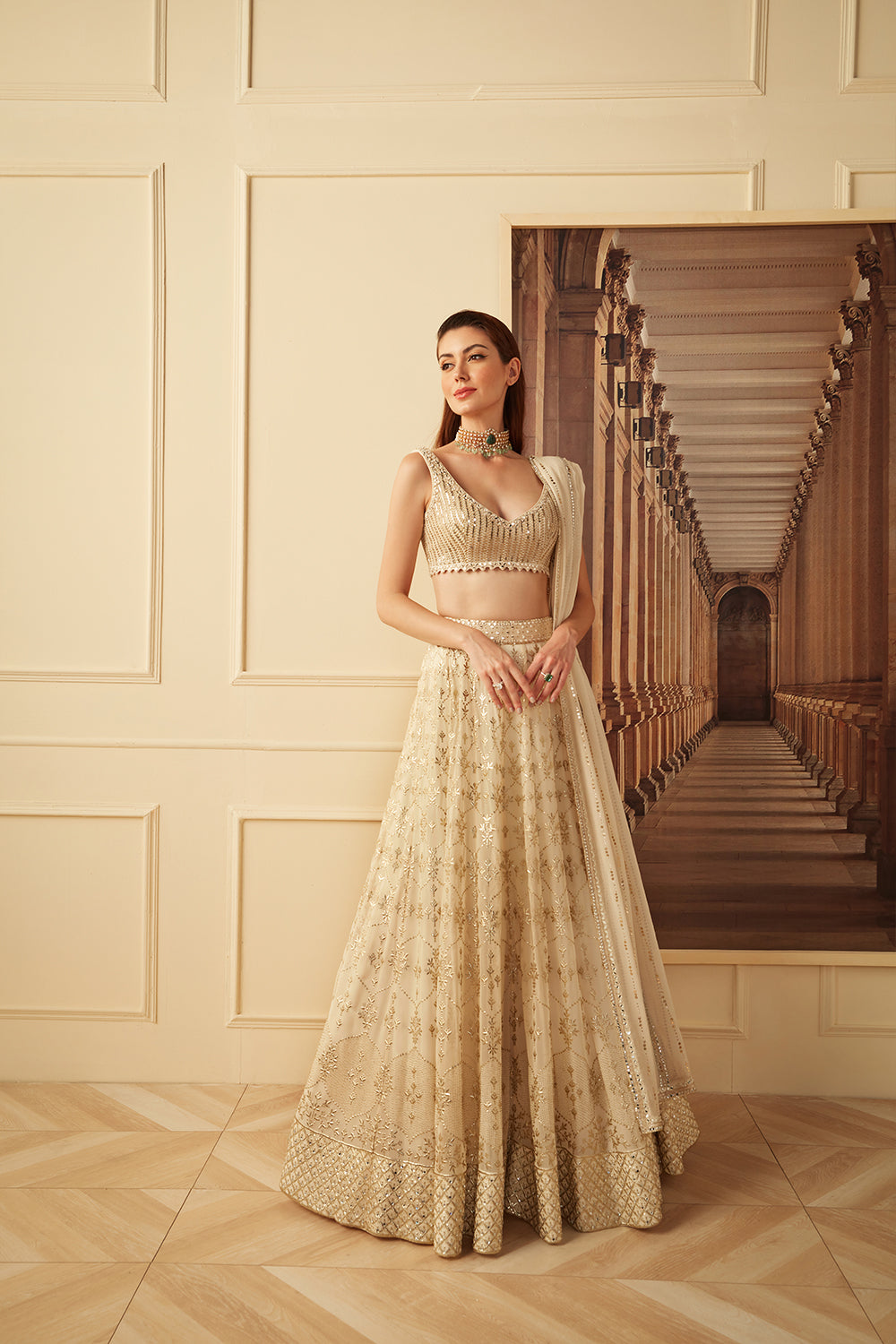 Ivory and gold badala work lehenga set.
