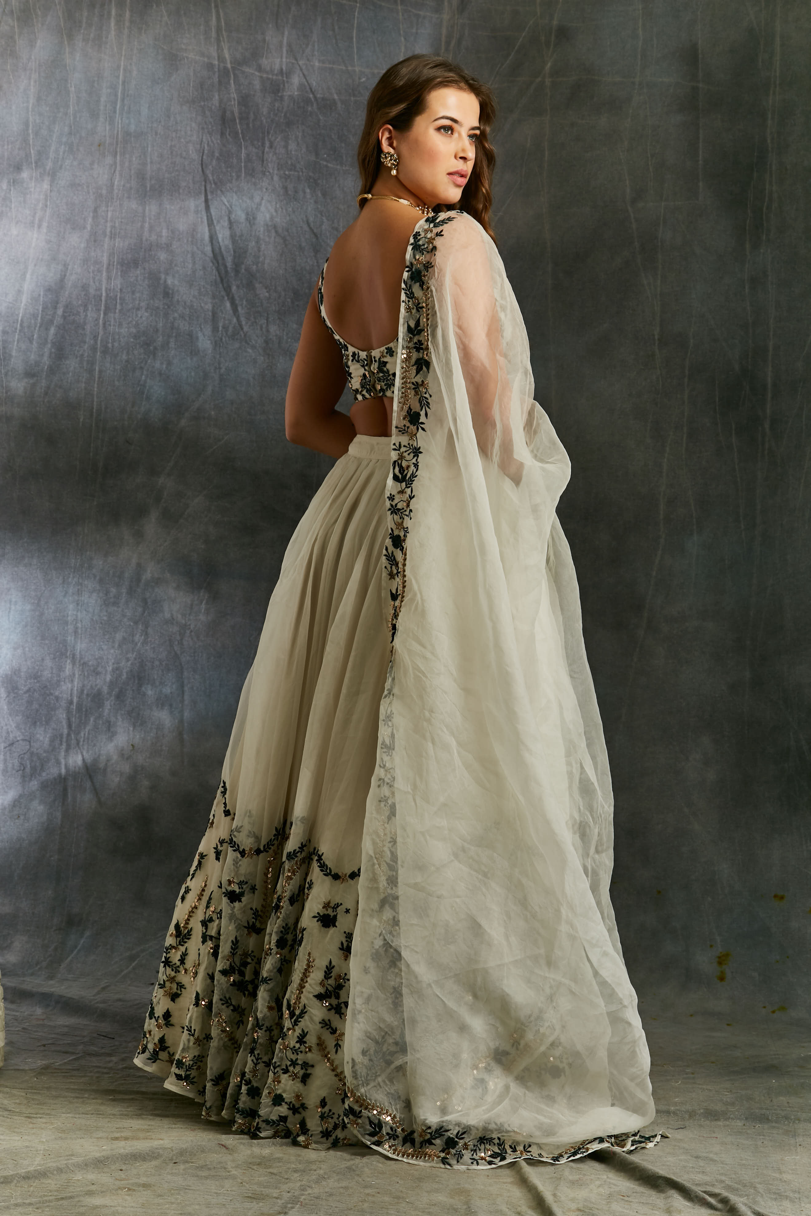 White Organza With Green And Black Threadwork Lehenga