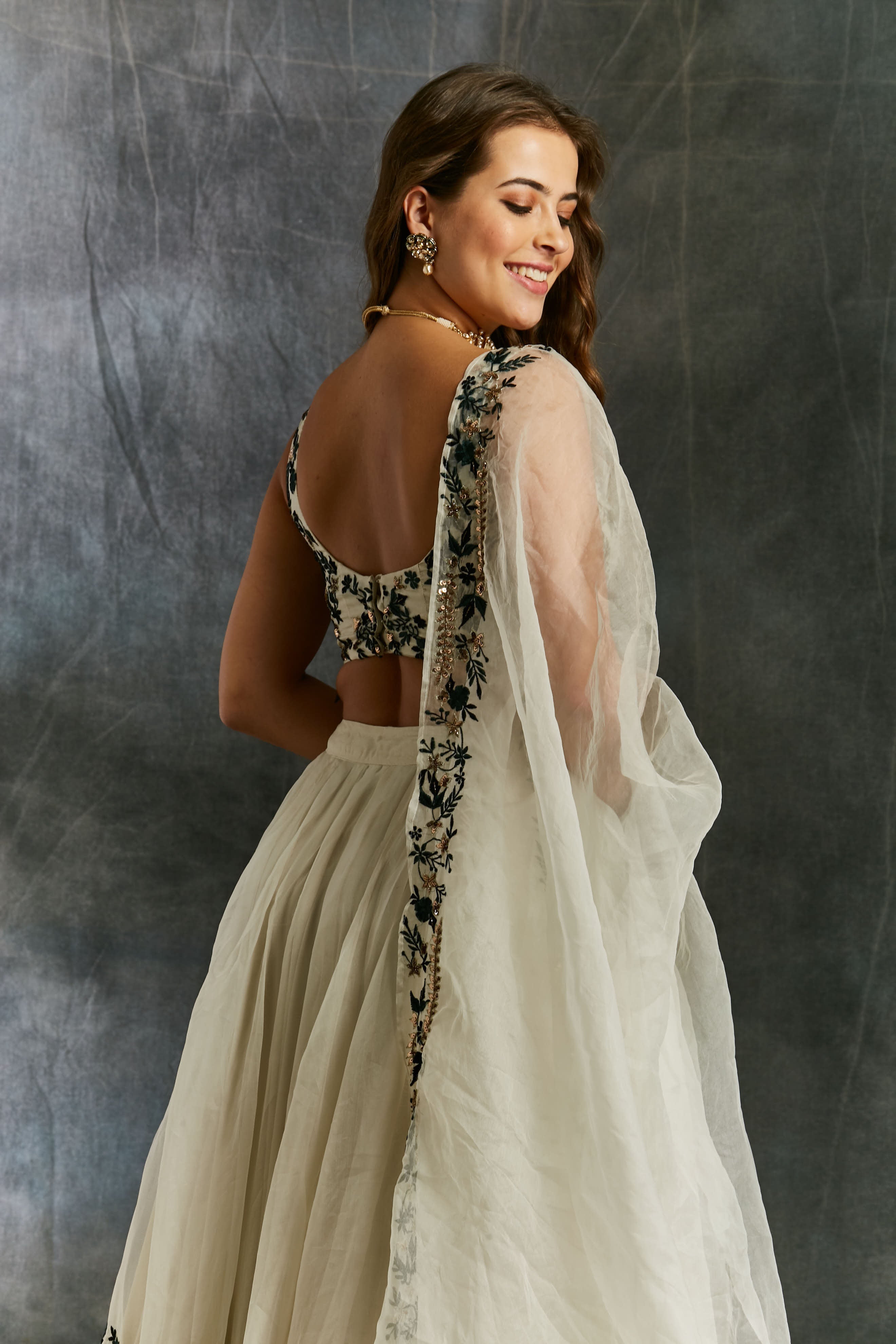 White Organza With Green And Black Threadwork Lehenga