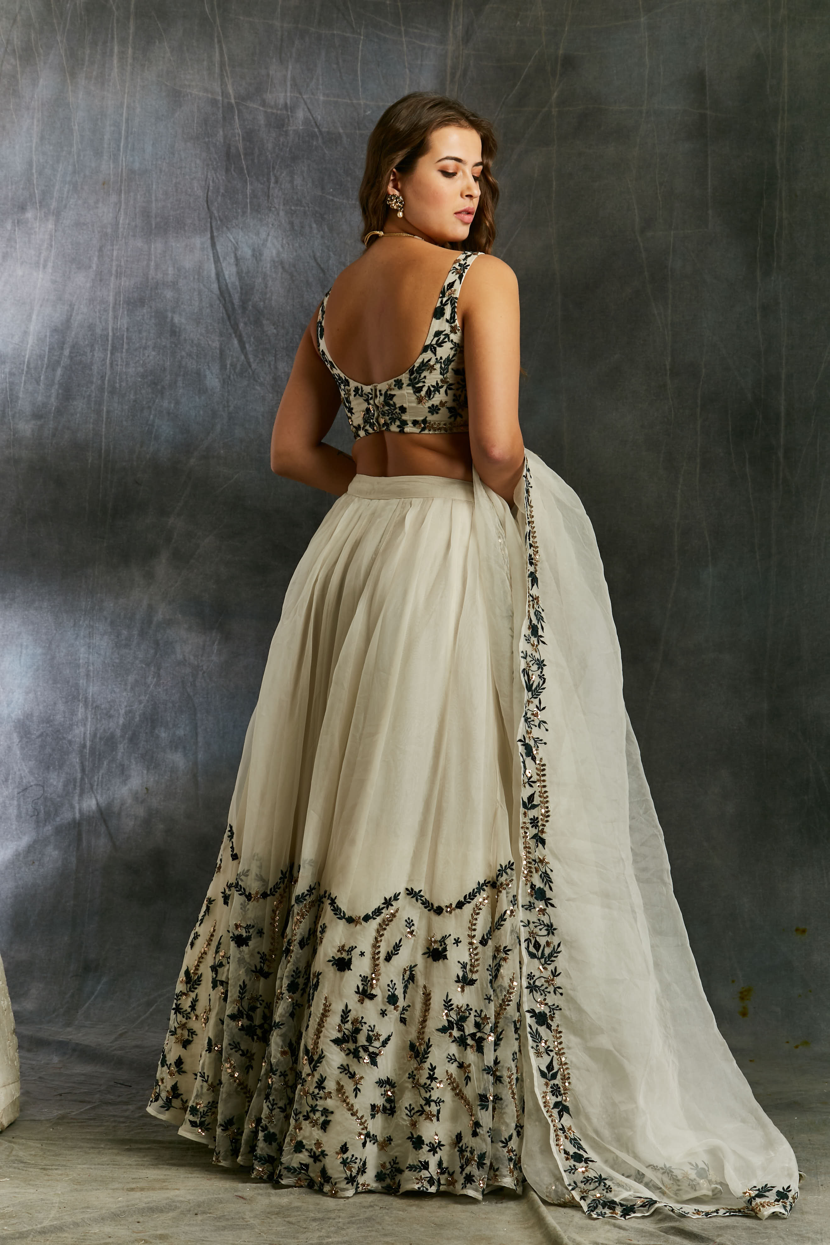 White Organza With Green And Black Threadwork Lehenga