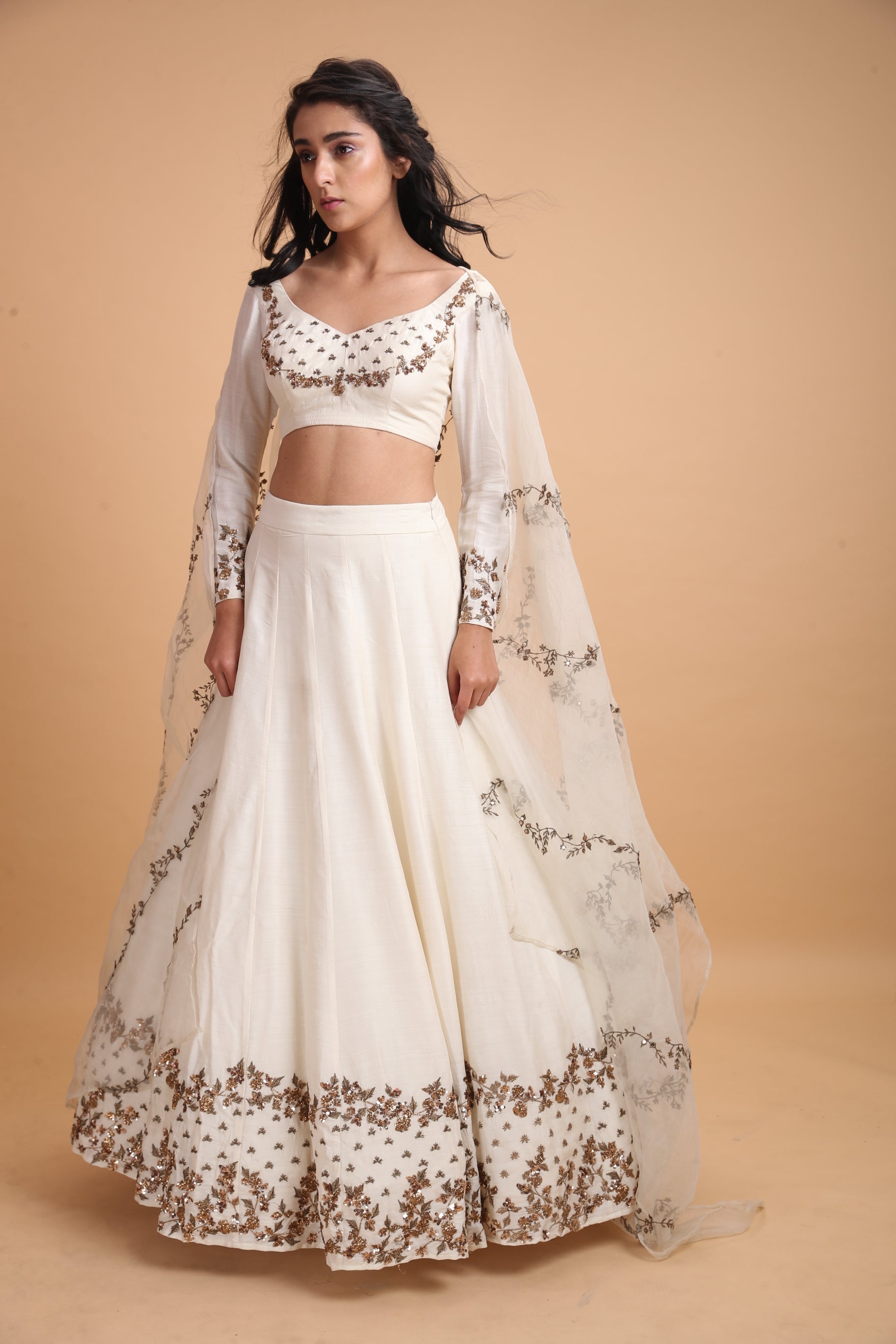 White Silk Lehenga With Dark Gold Work