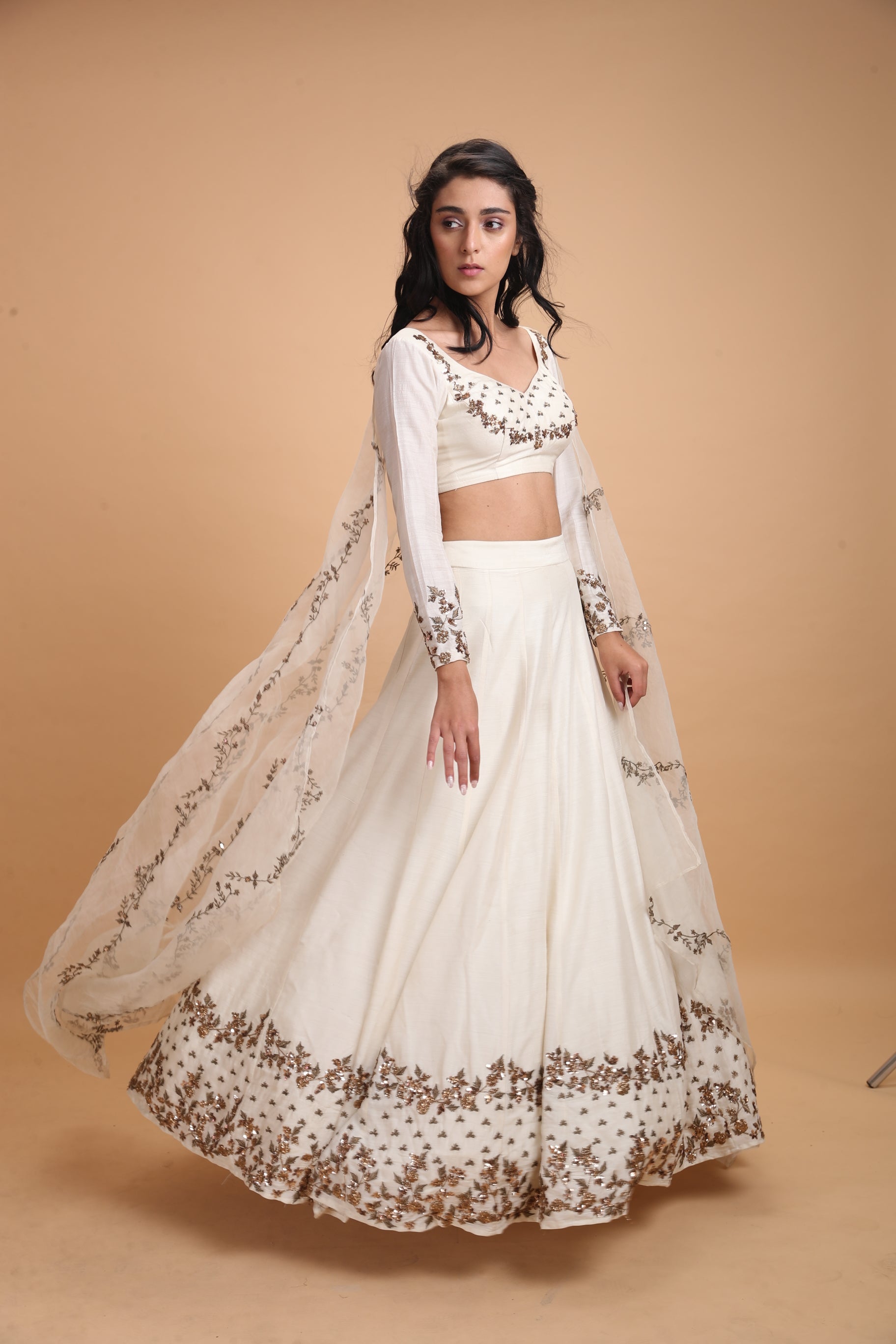 White Silk Lehenga With Dark Gold Work