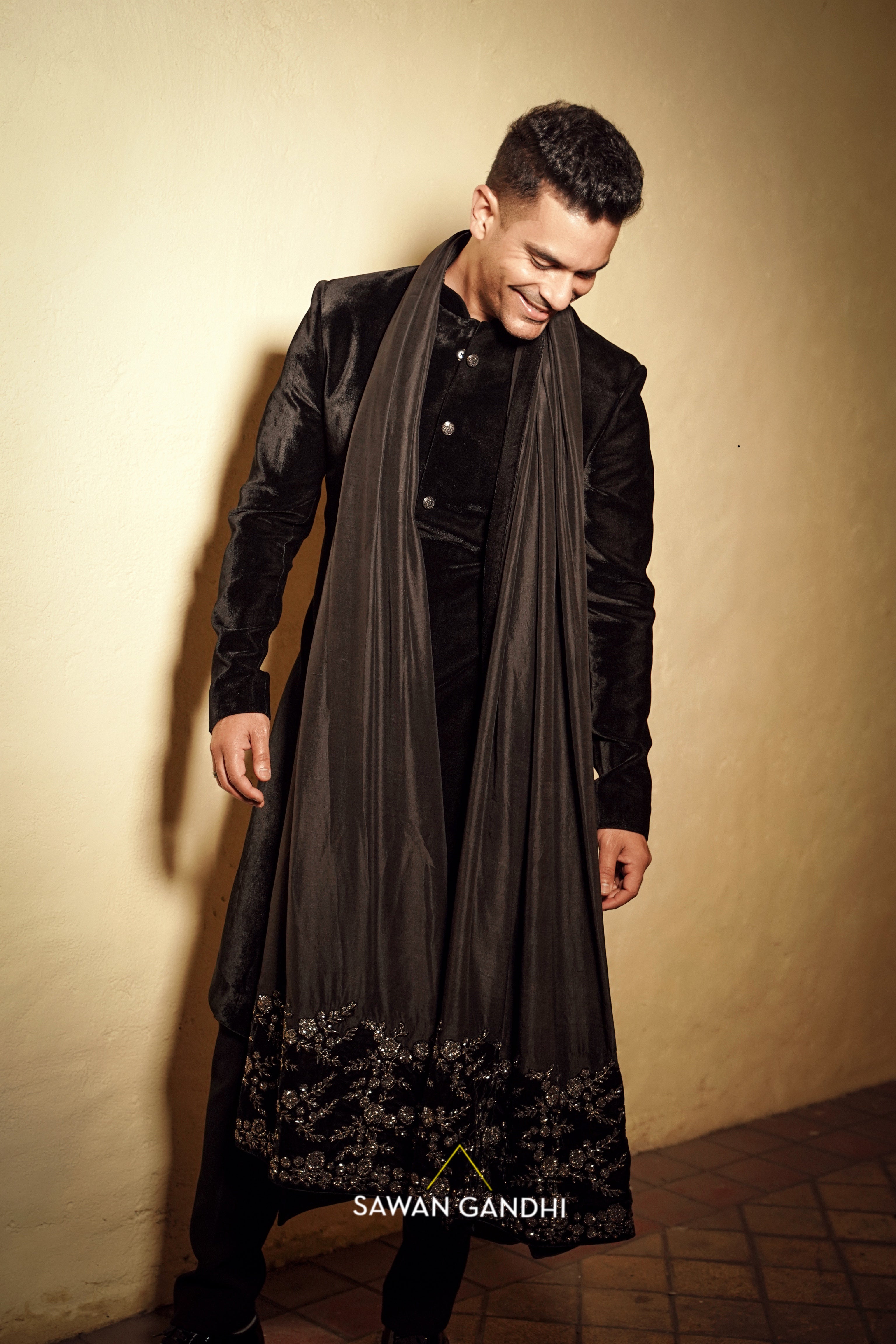 Angad bedi in Black velvet sherwani with tuape black stole