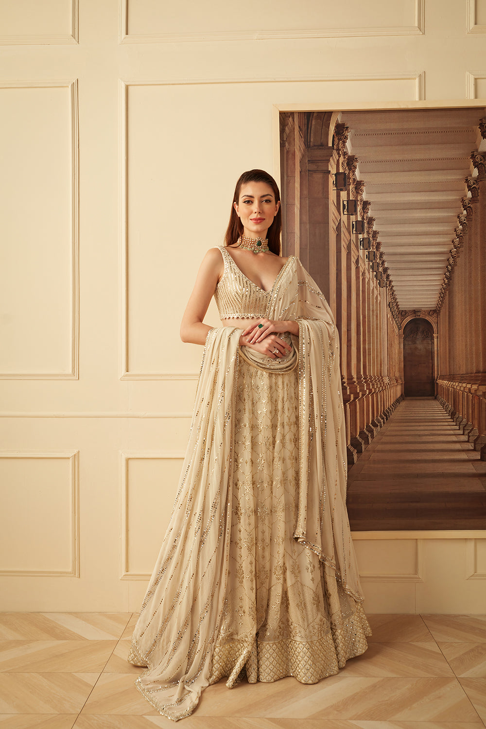 Ivory and gold badala work lehenga set.