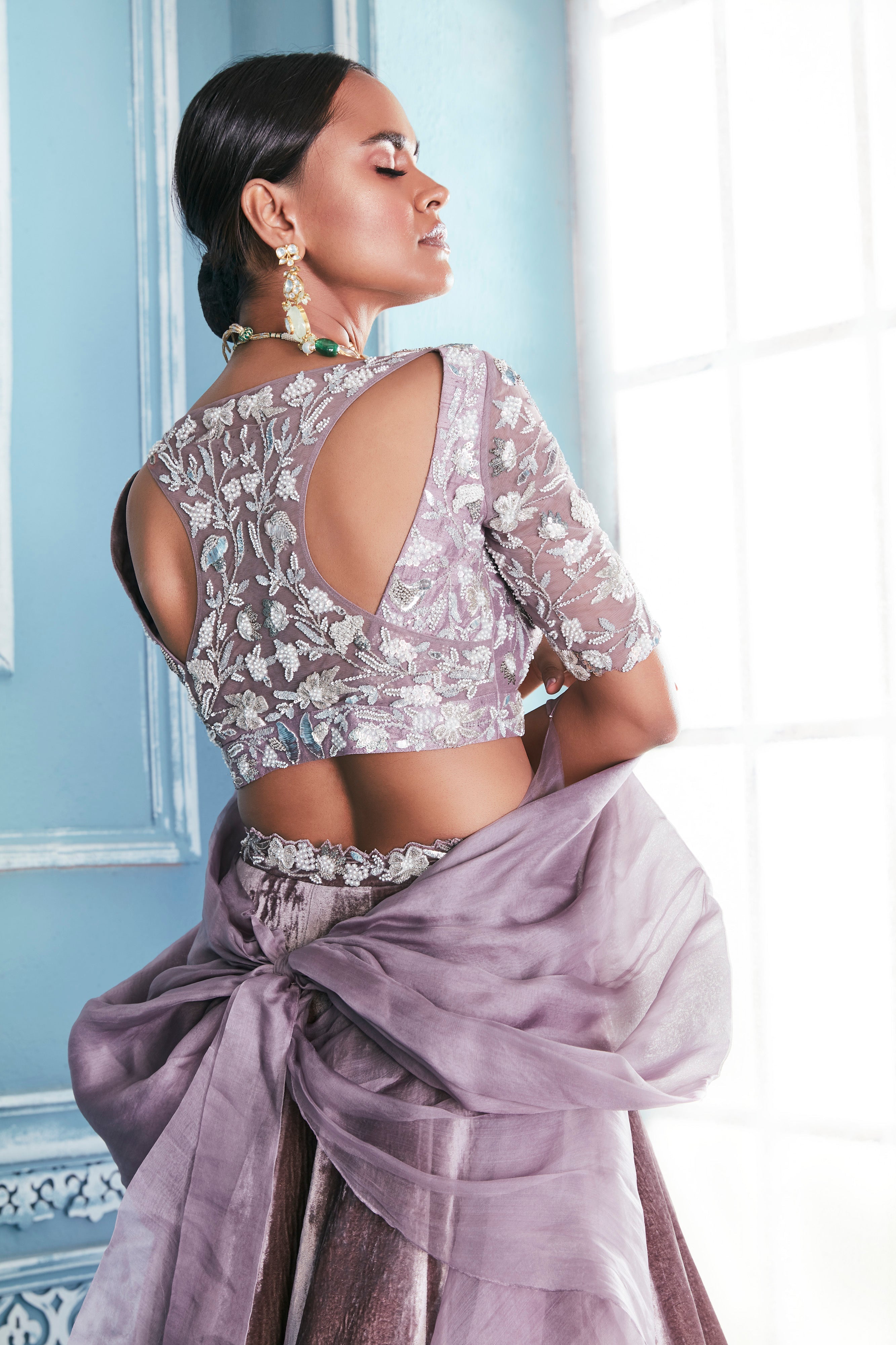 Razer Back Blouse With Velvet Tulip Lehenga Set
