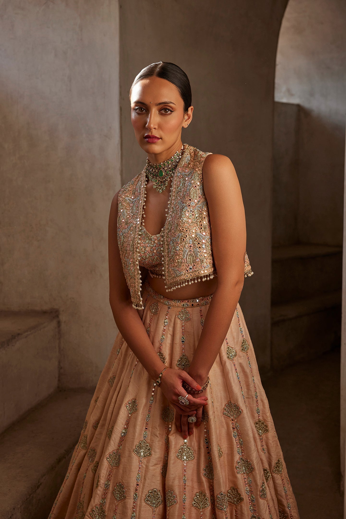 PEACH LEHENGA WITH SHORT JACKET AND BUSTIER