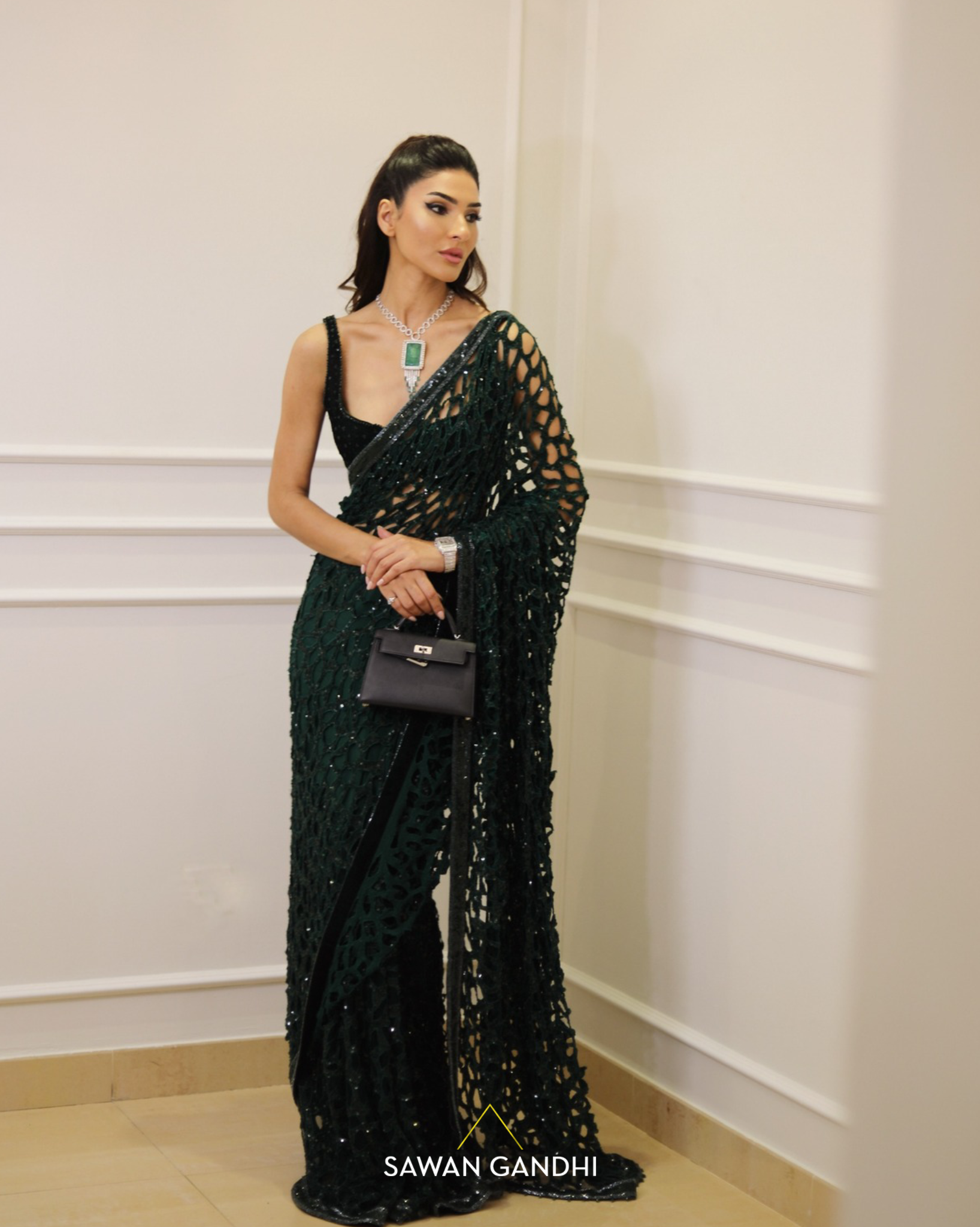 Kiran Malik in Bottle green cutwork saree