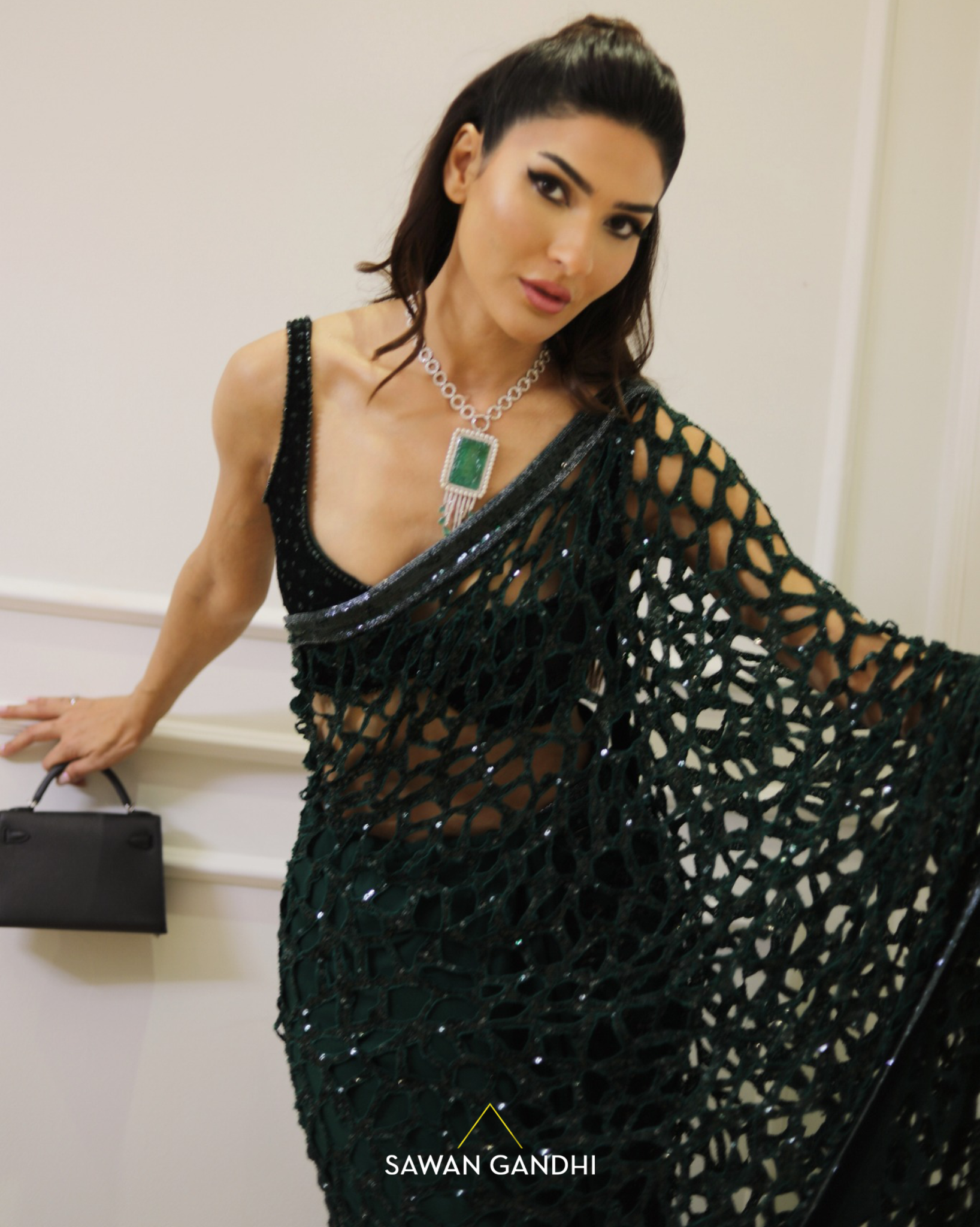 Kiran Malik in Bottle green cutwork saree