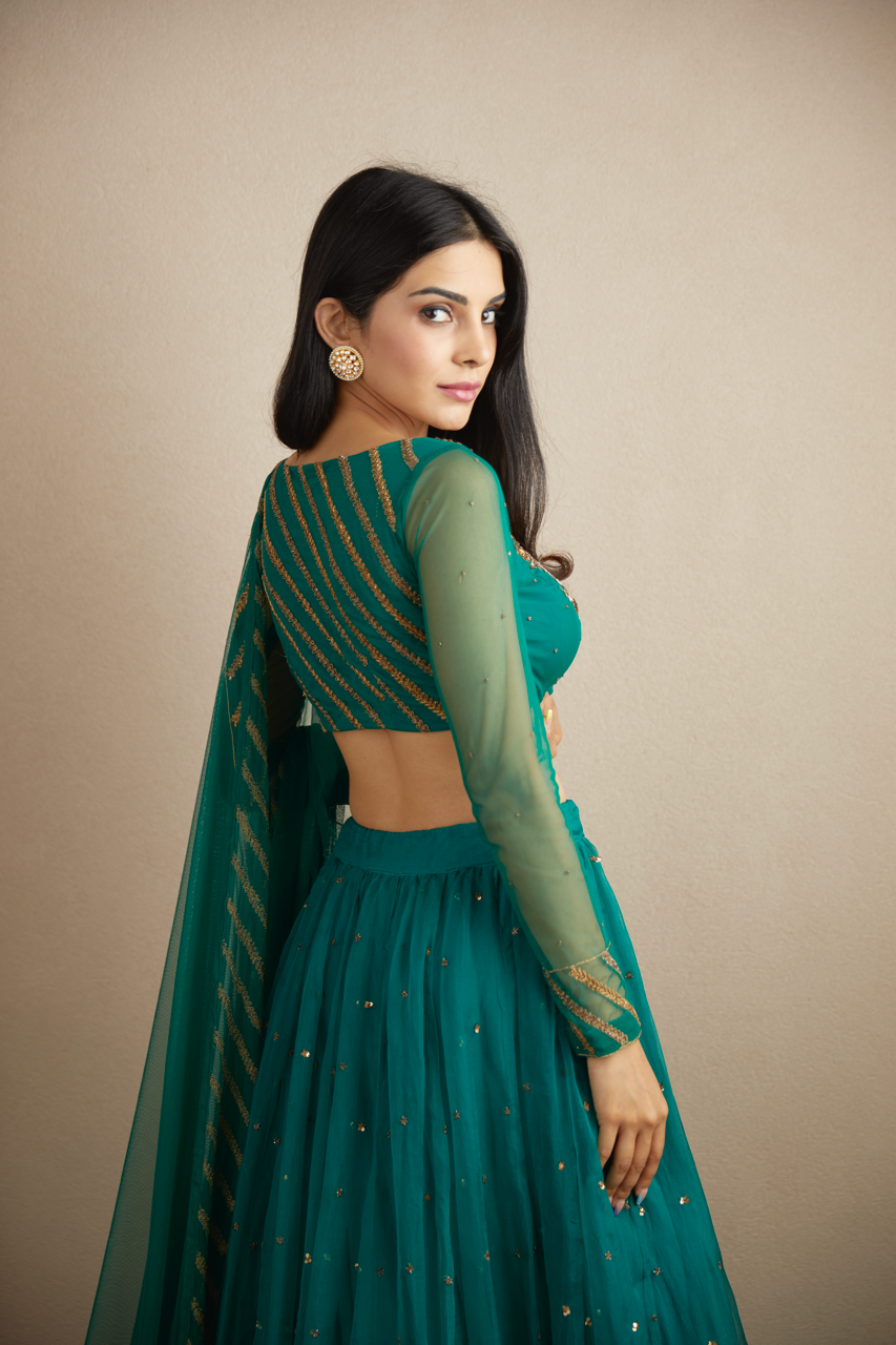 TEAL GREEN ANTIQUE SEQUENCE WORK LEHENGA SET