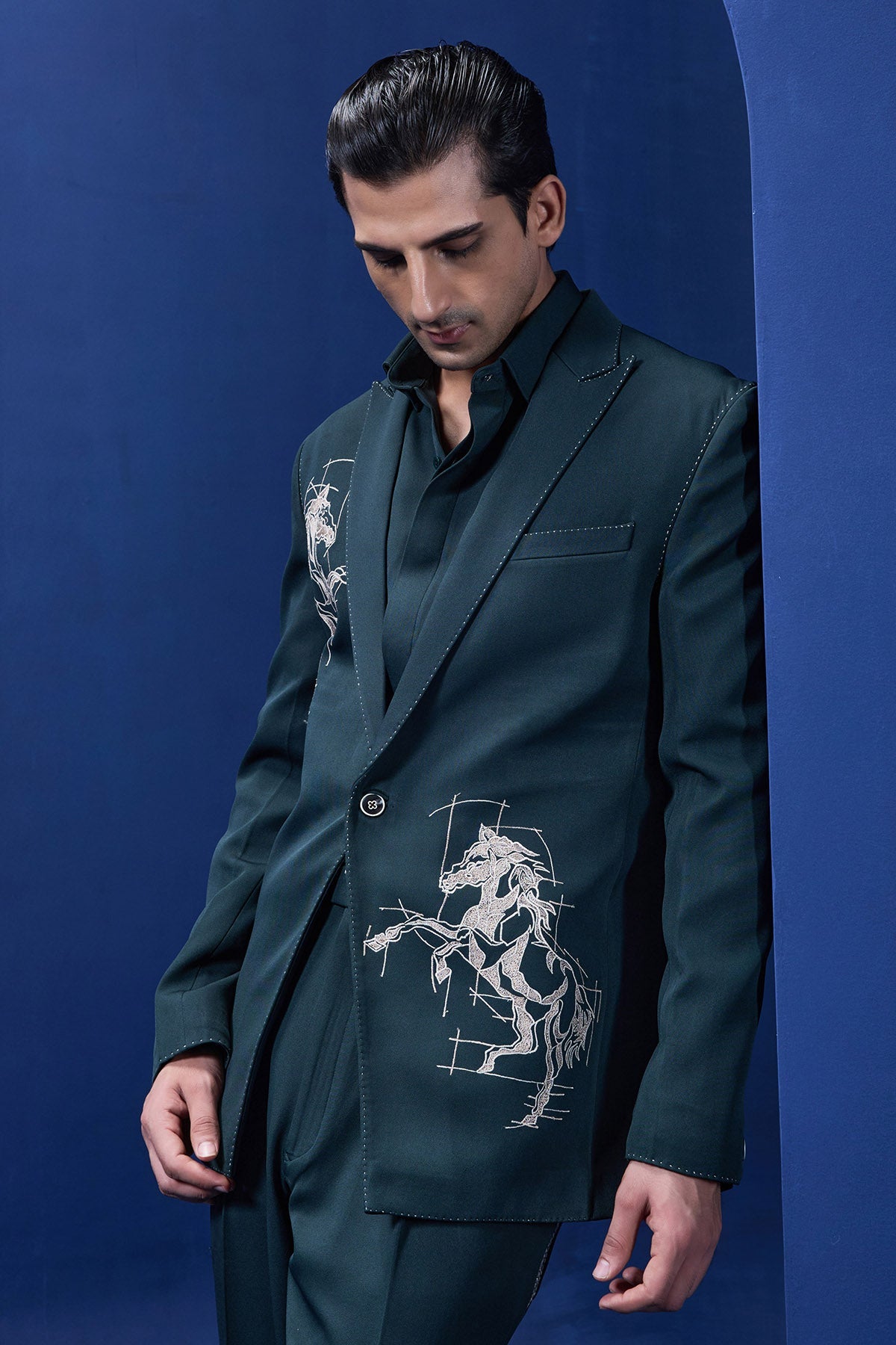 Green blazer detailing with thread work and horse embroidery