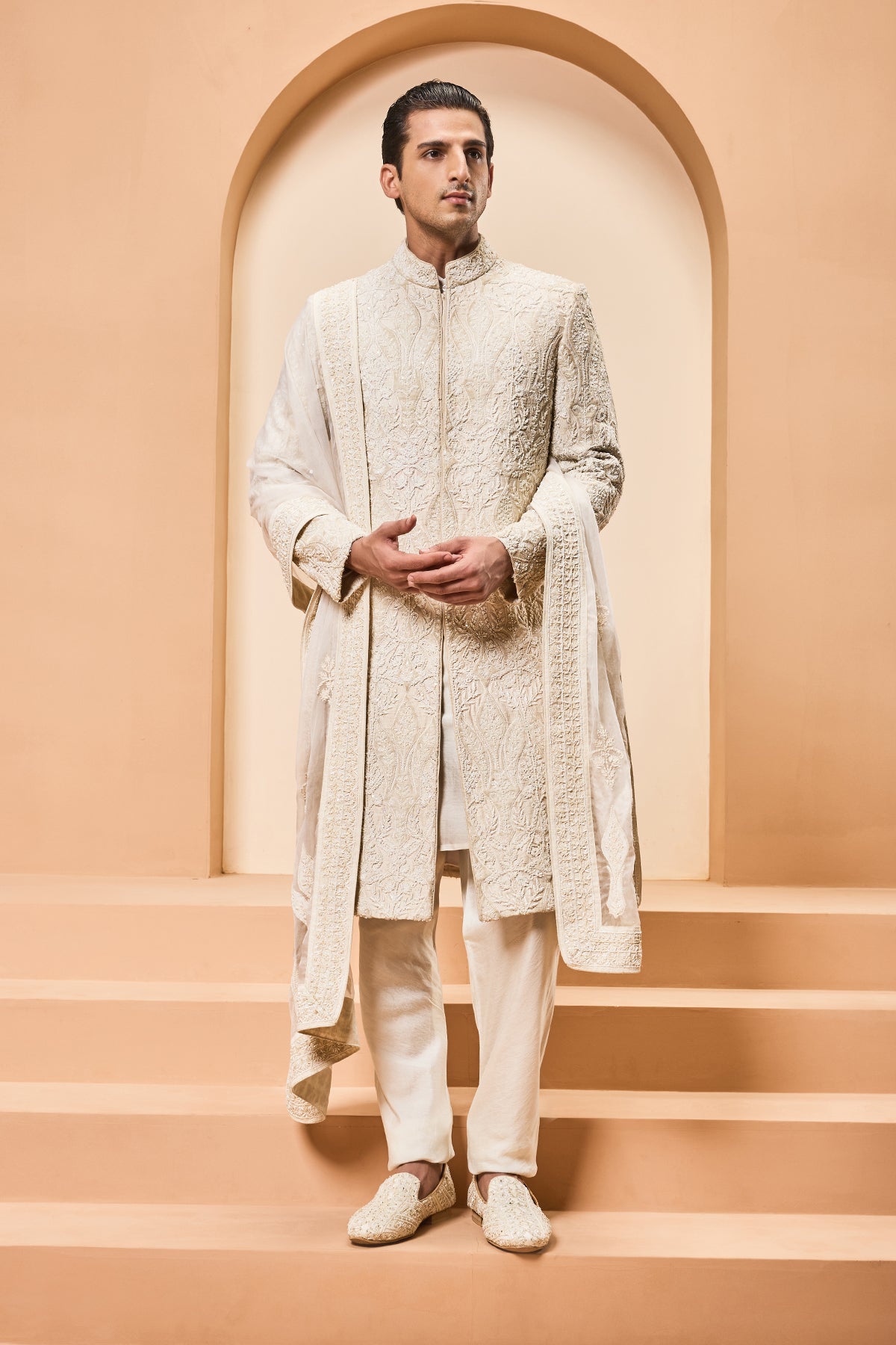 Ivory sherwani detailing with pearl sequins and aplic work
